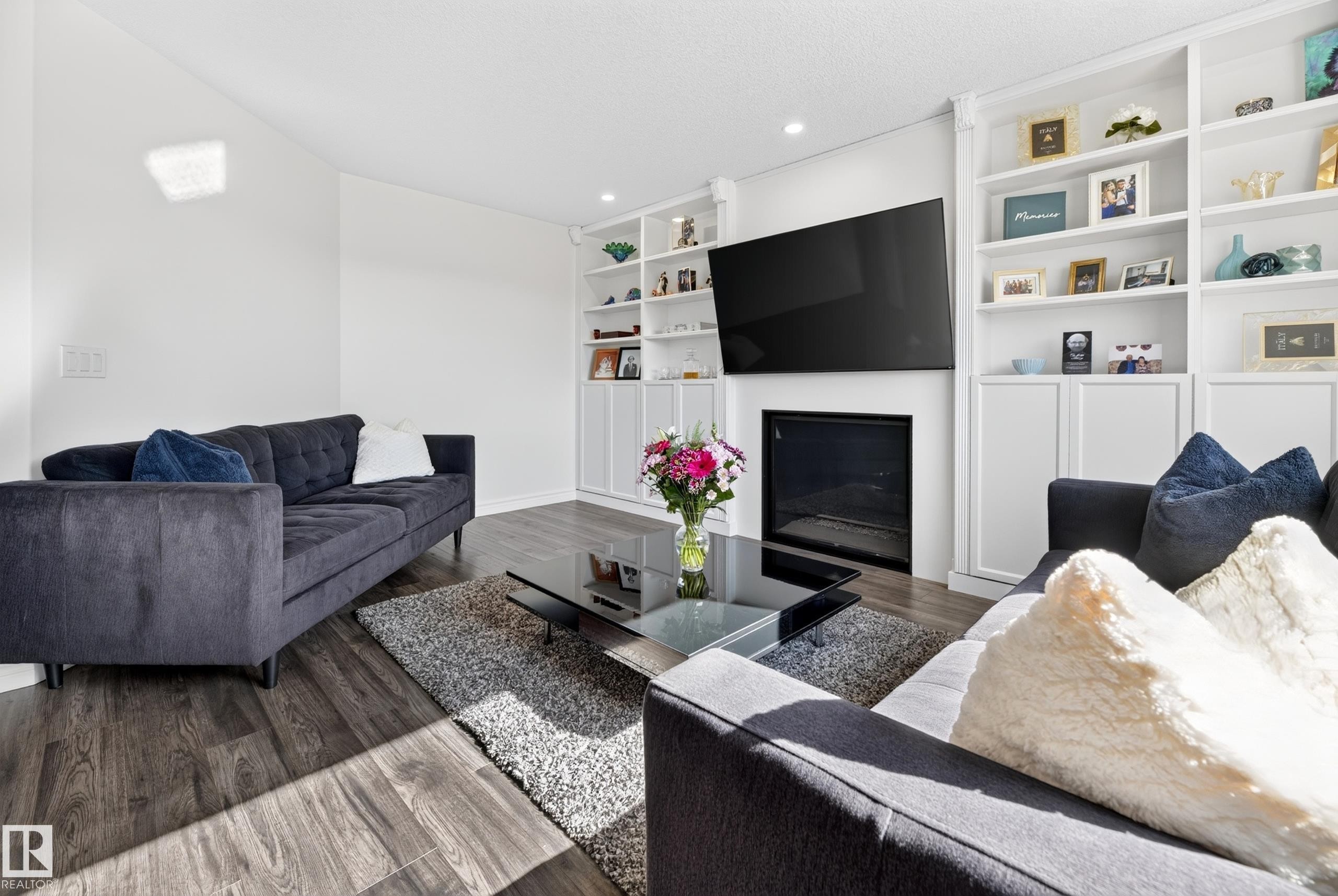 251 River Point(E) Nw, Edmonton, AB - Indoor Photo Showing Living Room With Fireplace