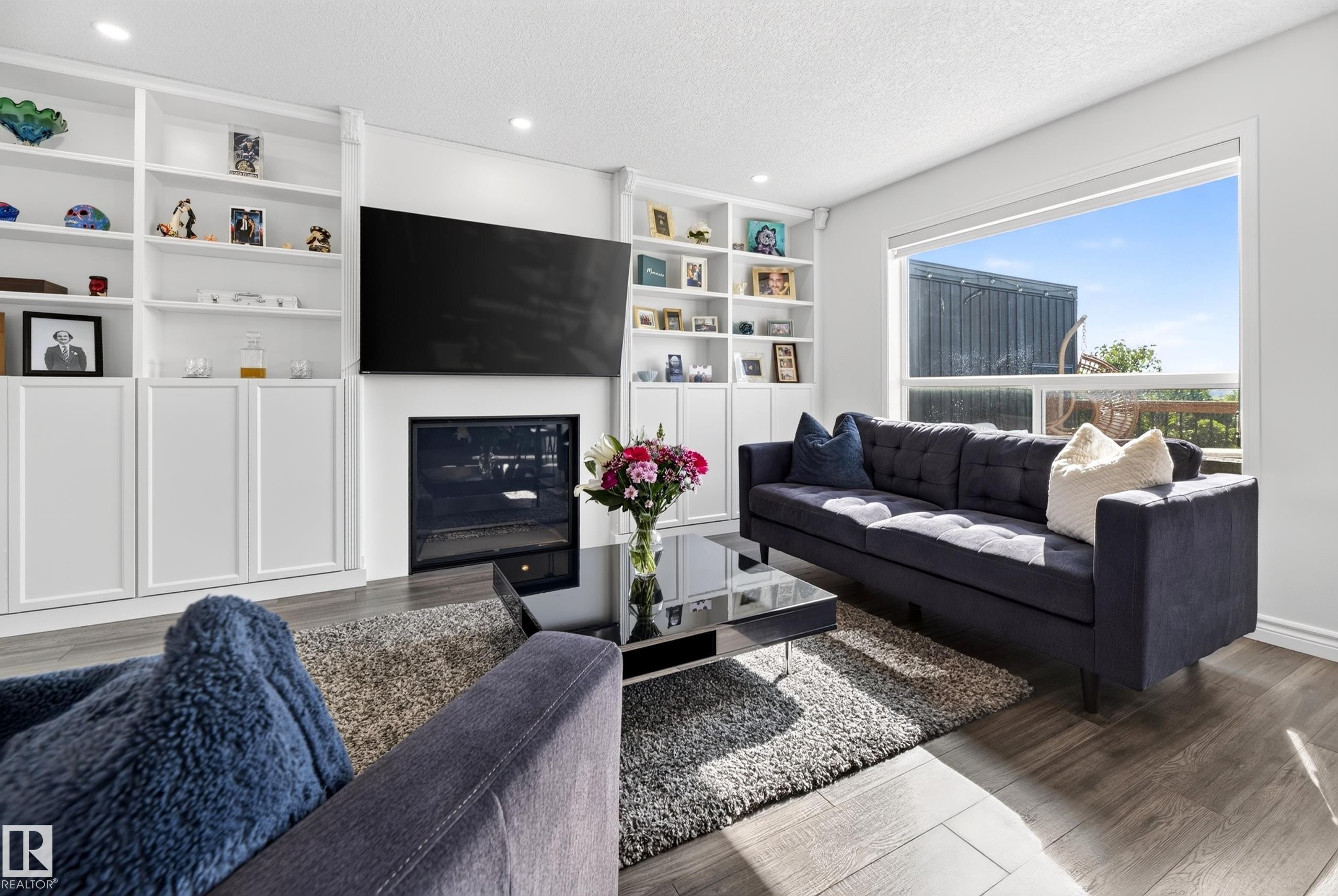 251 River Point(E) Nw, Edmonton, AB - Indoor Photo Showing Living Room With Fireplace