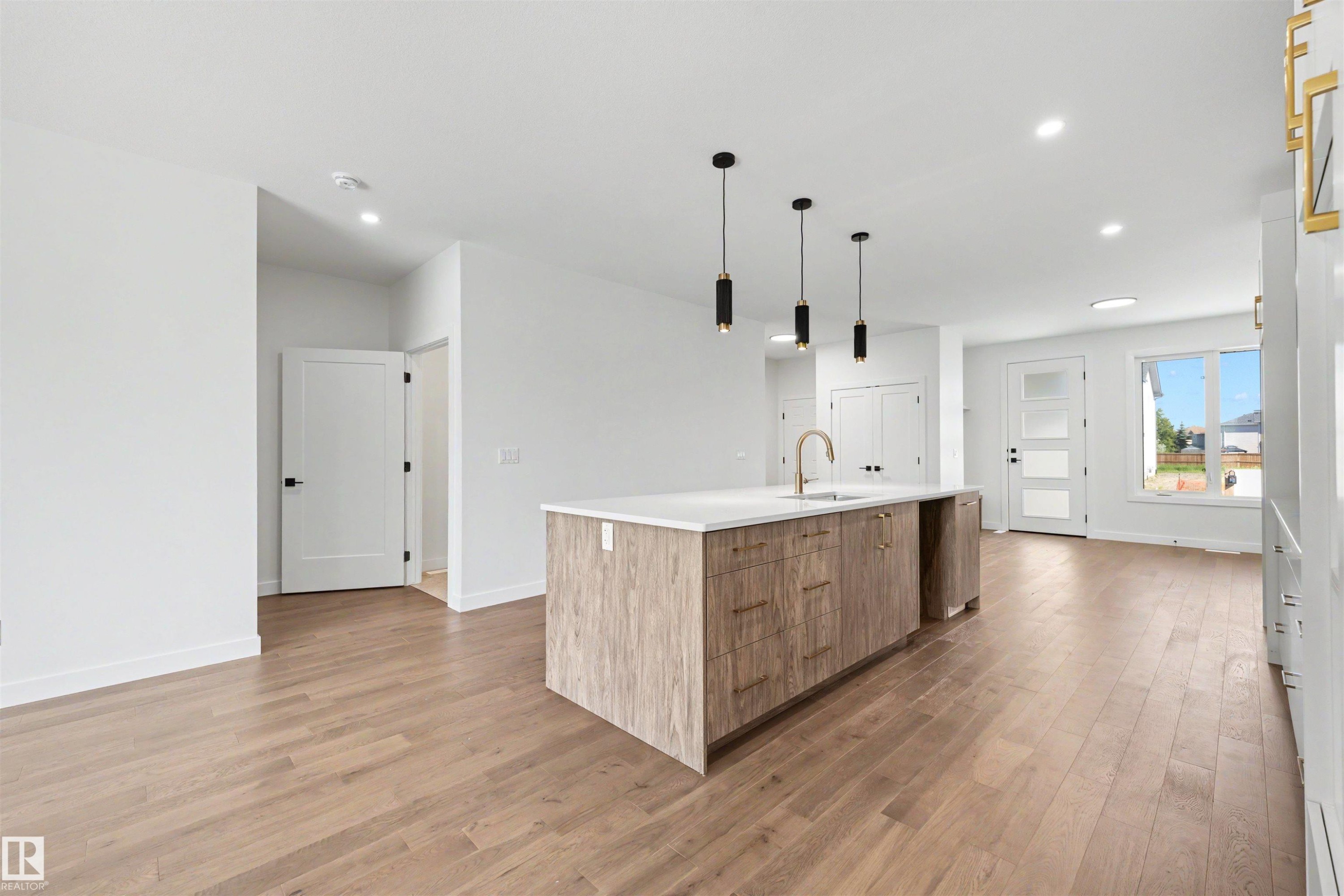 Open-concept living space with wood-finish flooring - 39 Elsinore Place, Edmonton, AB