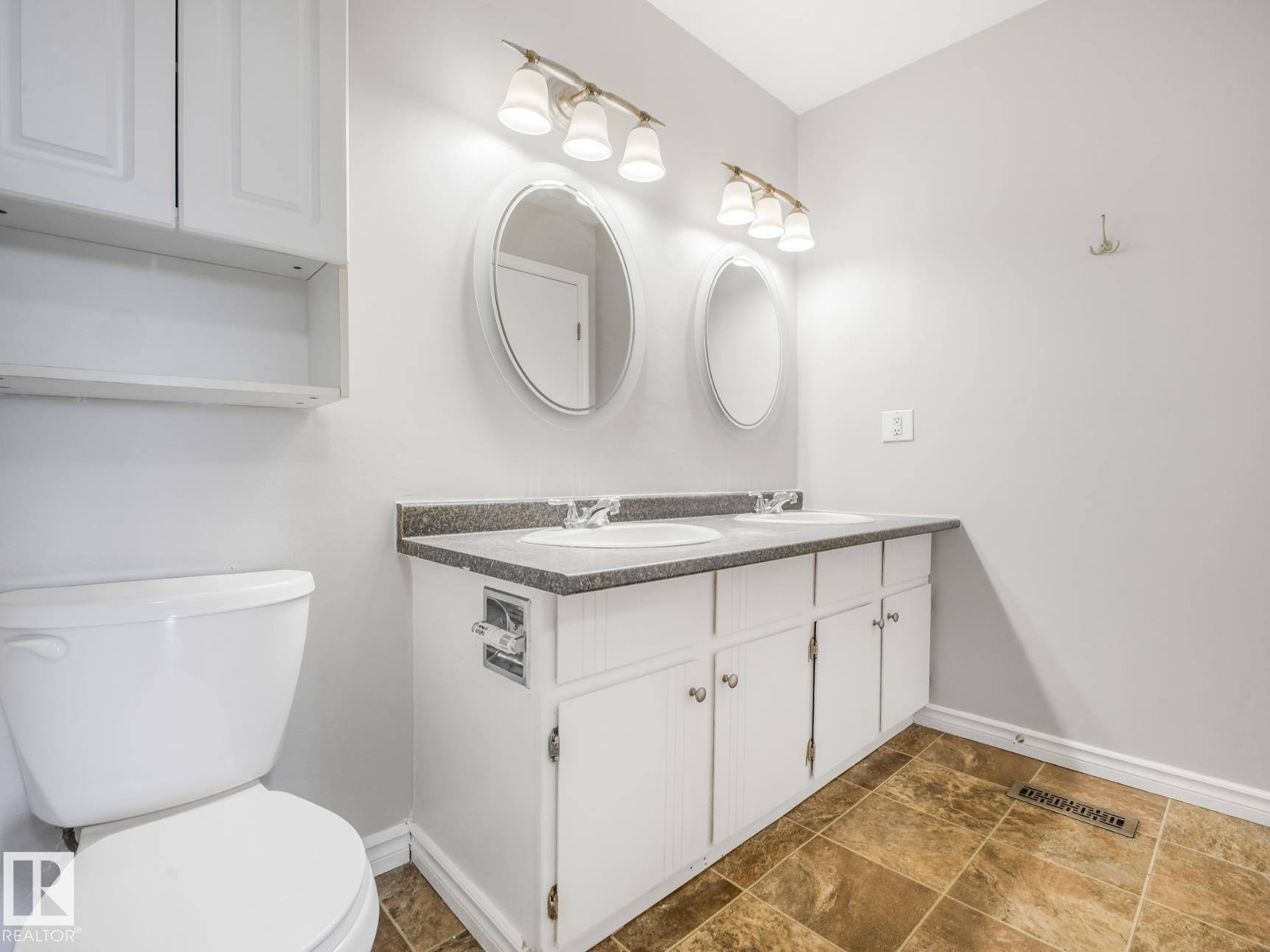 Double vanity with integrated sinks and a speckled countertop - #301 10528 29 Av Nw, Edmonton, AB