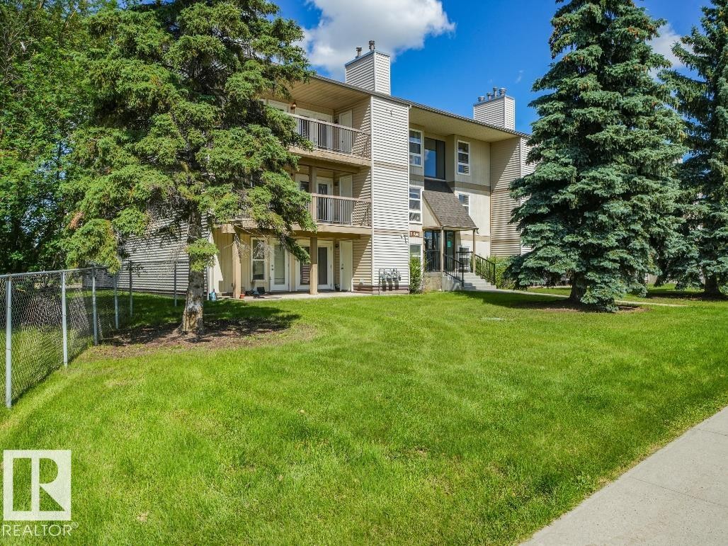 Multilevel residential building featuring private balconies, individual patio access, and a covered entry - #301 10528 29 Av Nw, Edmonton, AB