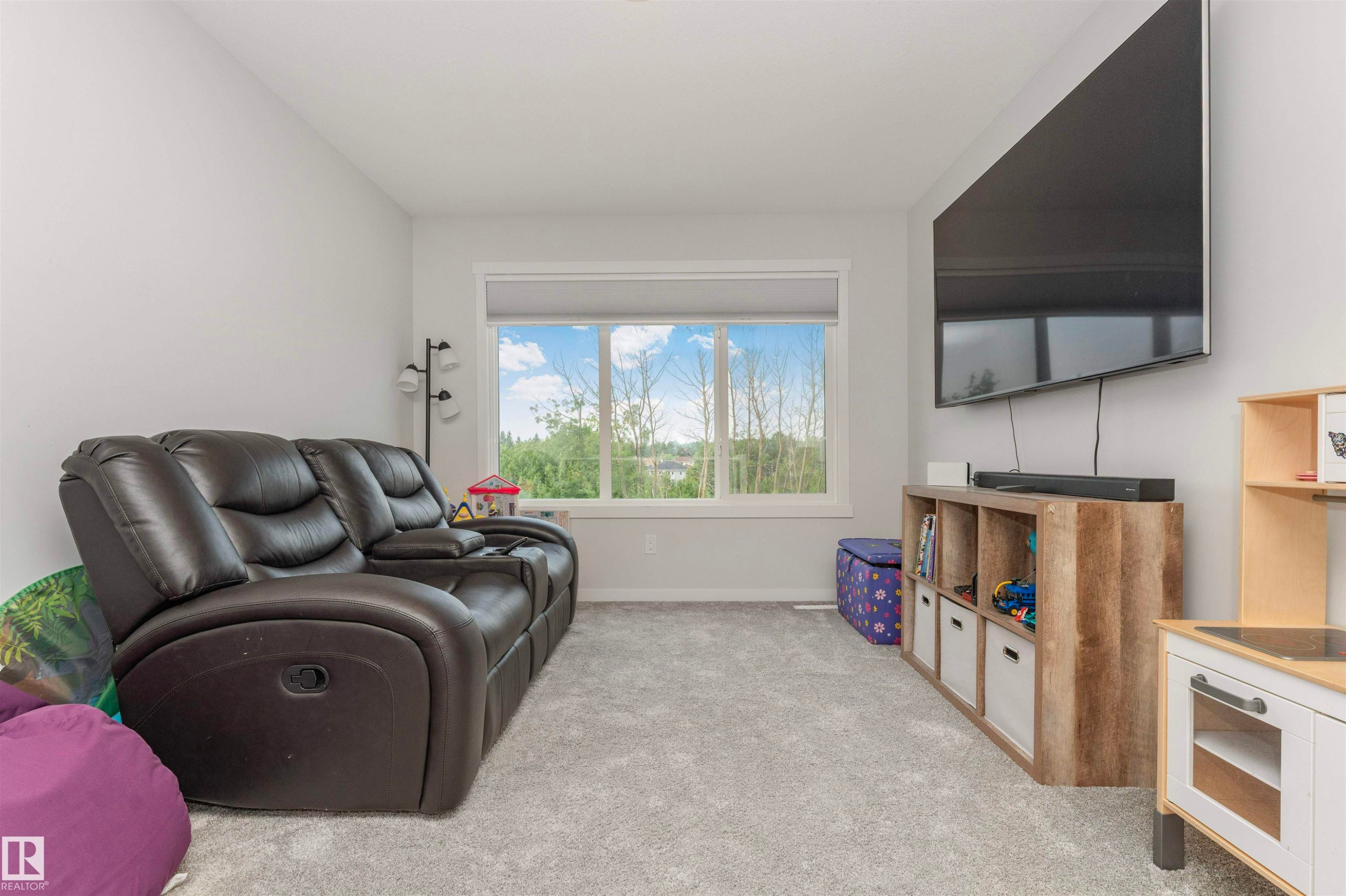 Interior room featuring light gray walls and light gray carpeted flooring - 102 Horton Way, Ardrossan, AB