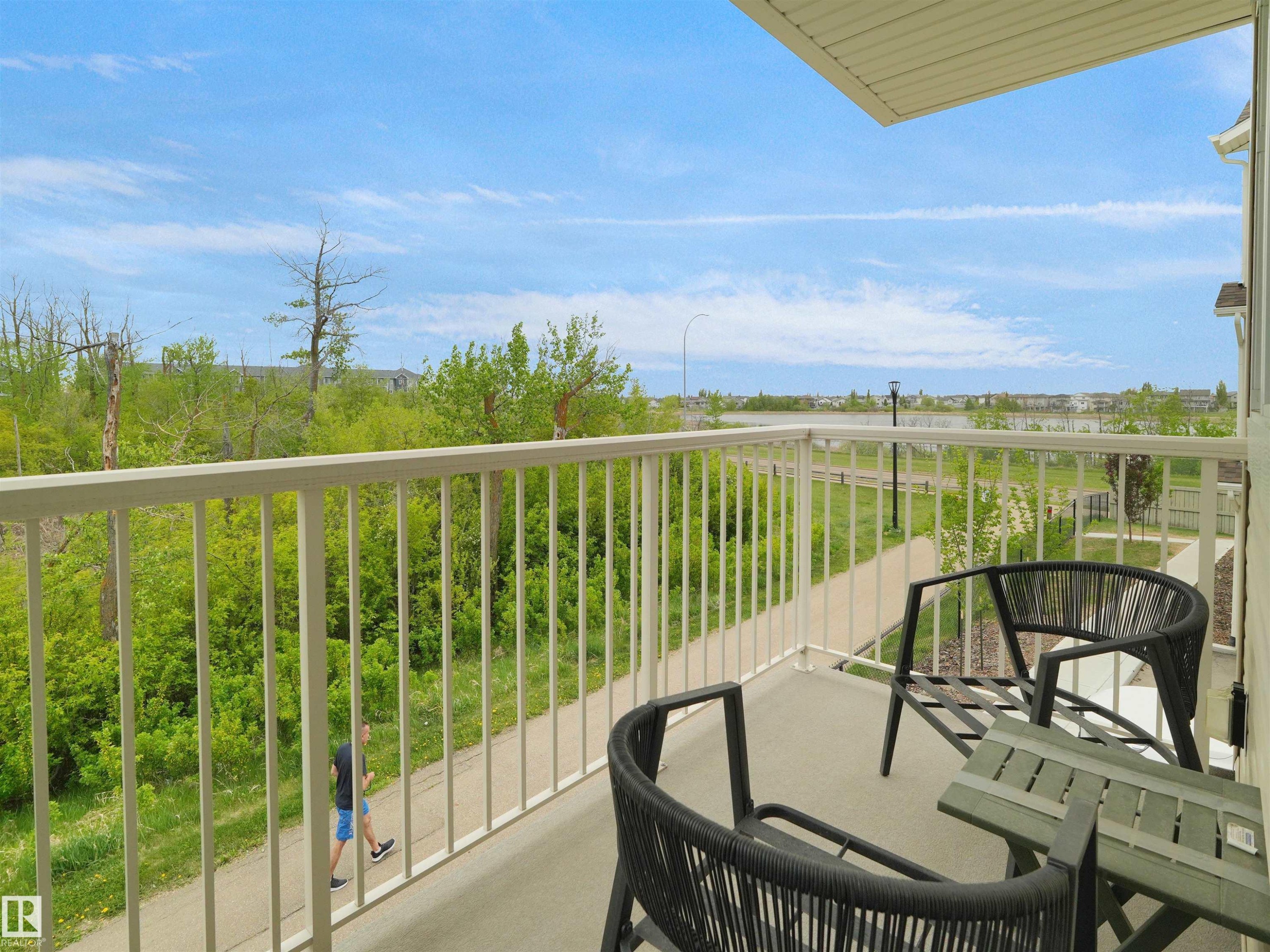 Private balcony with a concrete floor and white metal railings - #49 17832 78 St Nw, Edmonton, AB - Outdoor With Balcony With View With Exterior