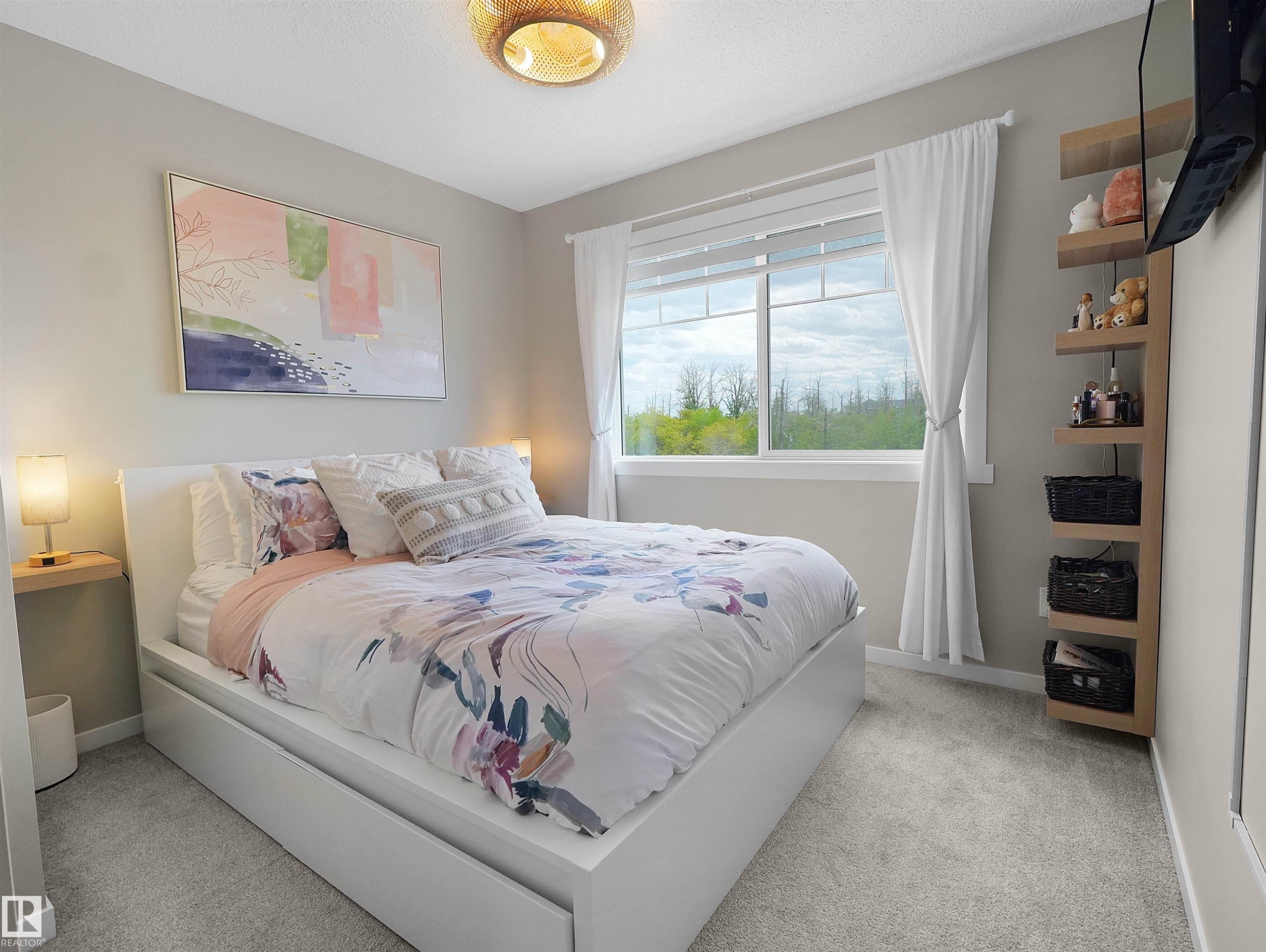 Bedroom featuring light gray wall paint, light gray carpet flooring, a large window with white blinds and curtains, and a wood-slat ceiling fixture - #49 17832 78 St Nw, Edmonton, AB - Indoor Photo Showing Bedroom