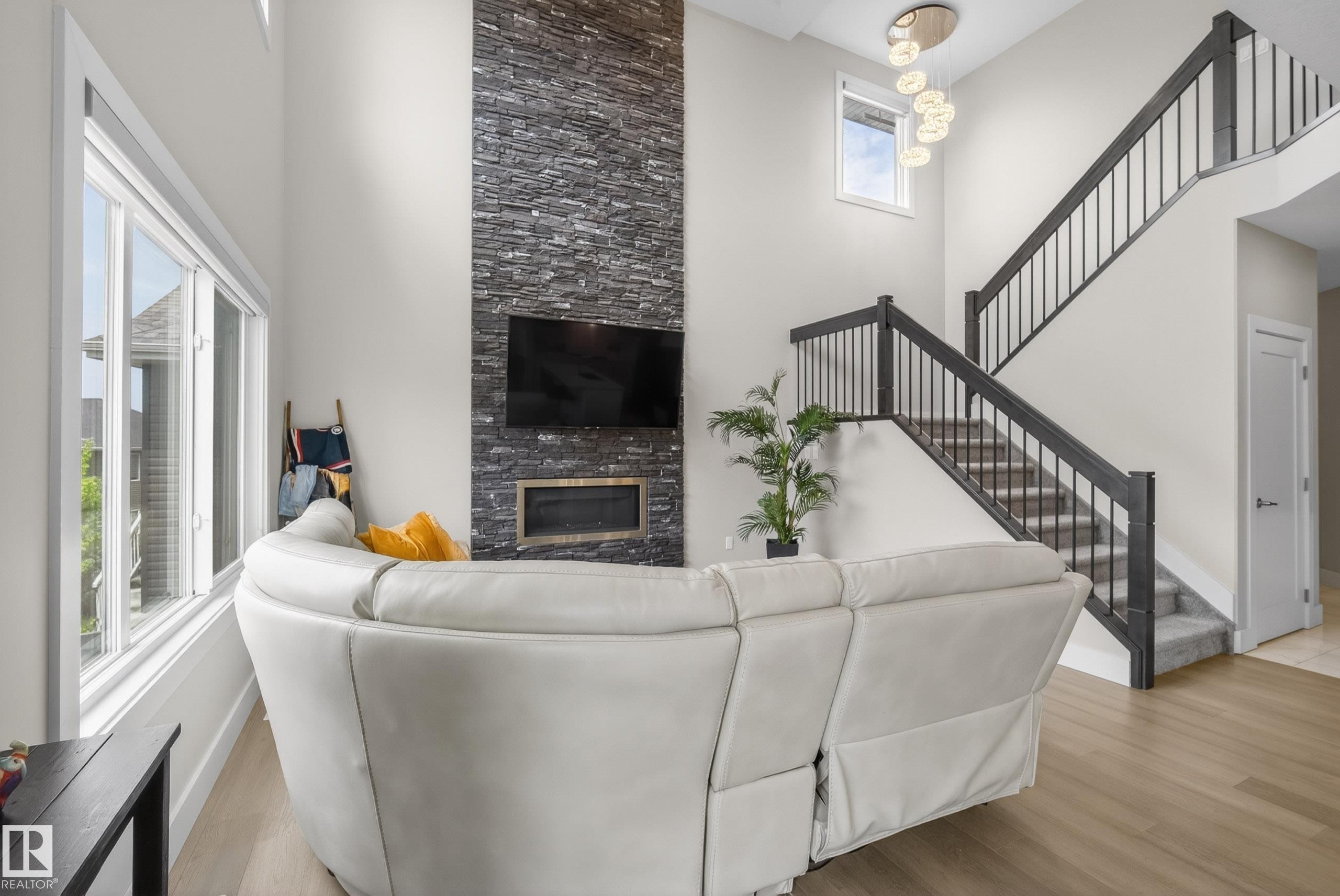 1817 Tanager Close, Edmonton, AB - Indoor Photo Showing Other Room With Fireplace