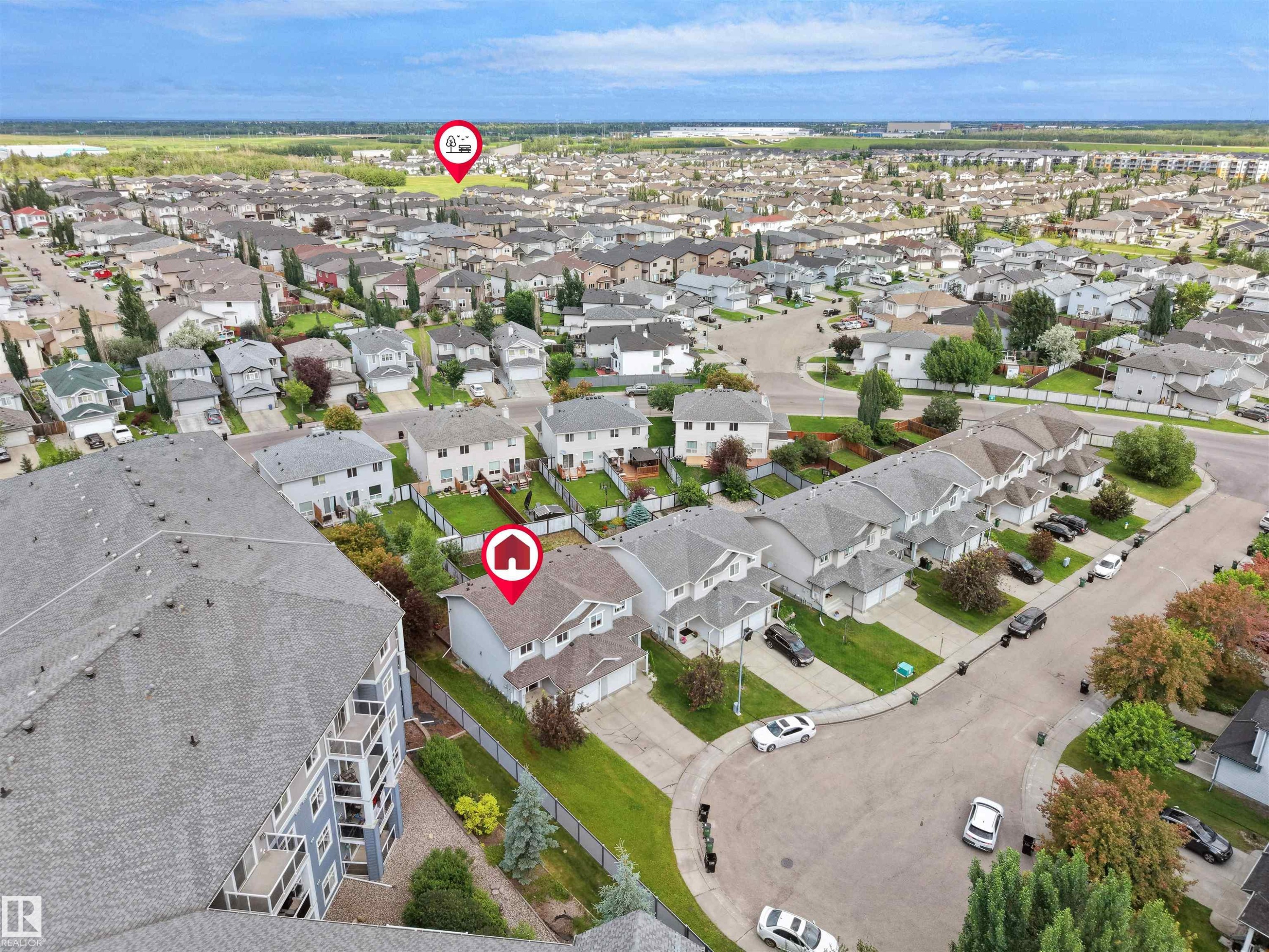 Aerial perspective showcasing a residential neighborhood with a mix of detached and attached housing - 16106 131A Street Nw, Edmonton, AB - Outdoor With View