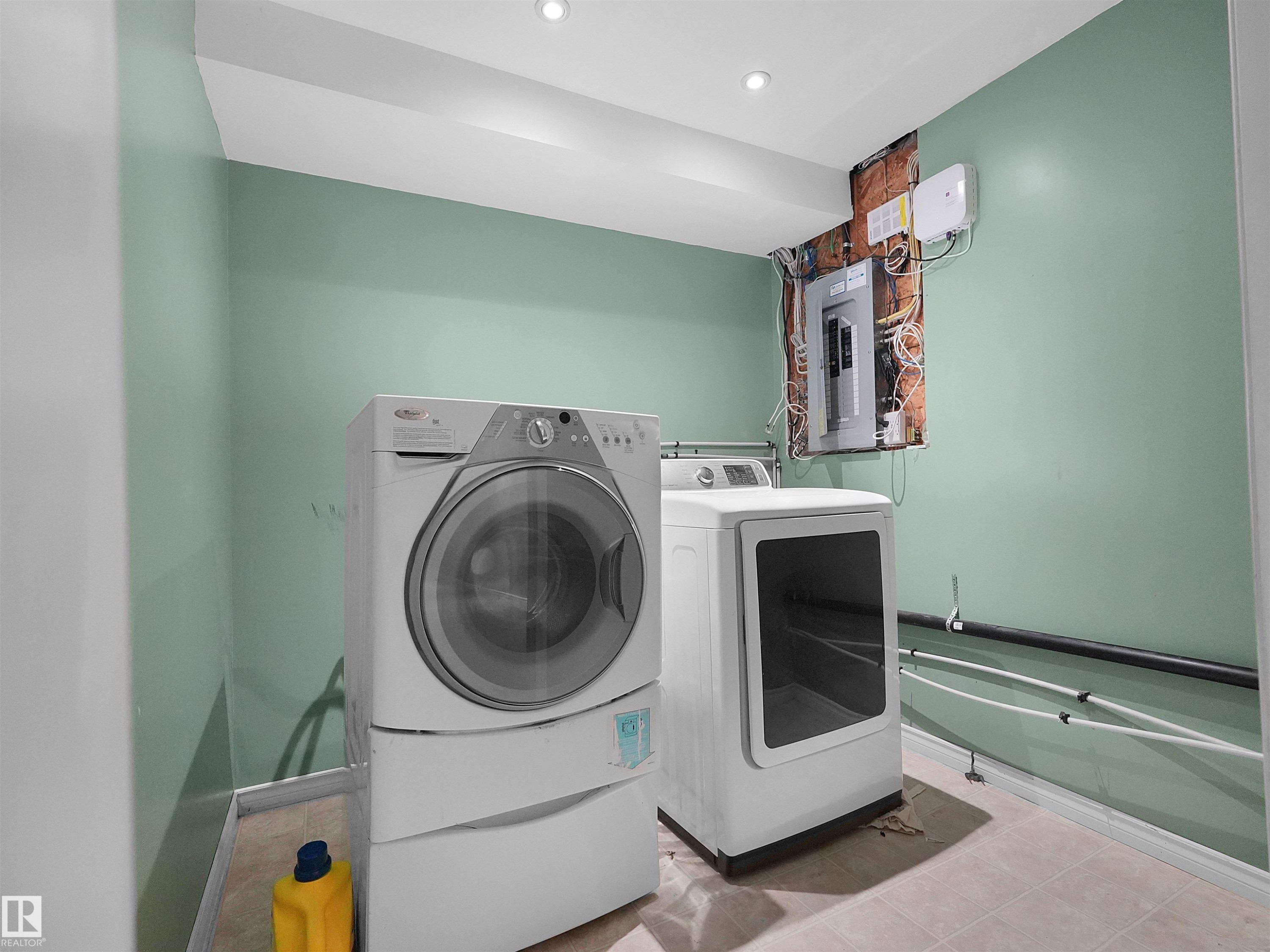 Dedicated laundry area with recessed lighting and neutral flooring - 16106 131A Street Nw, Edmonton, AB - Indoor Photo Showing Laundry Room