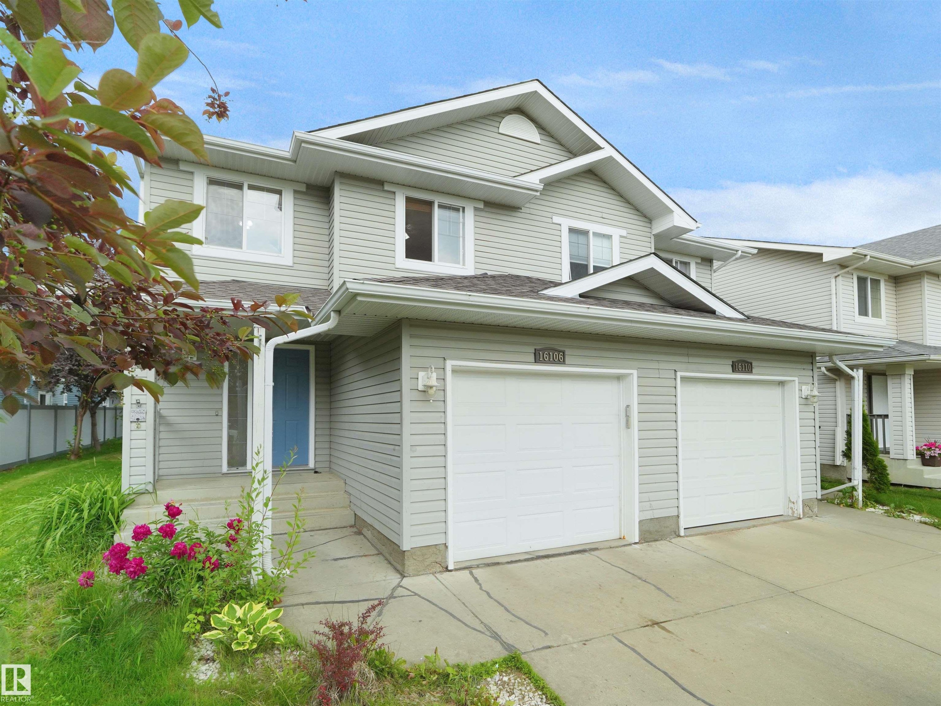 Two-story residence featuring light gray siding and white trim - 16106 131A Street Nw, Edmonton, AB - Outdoor
