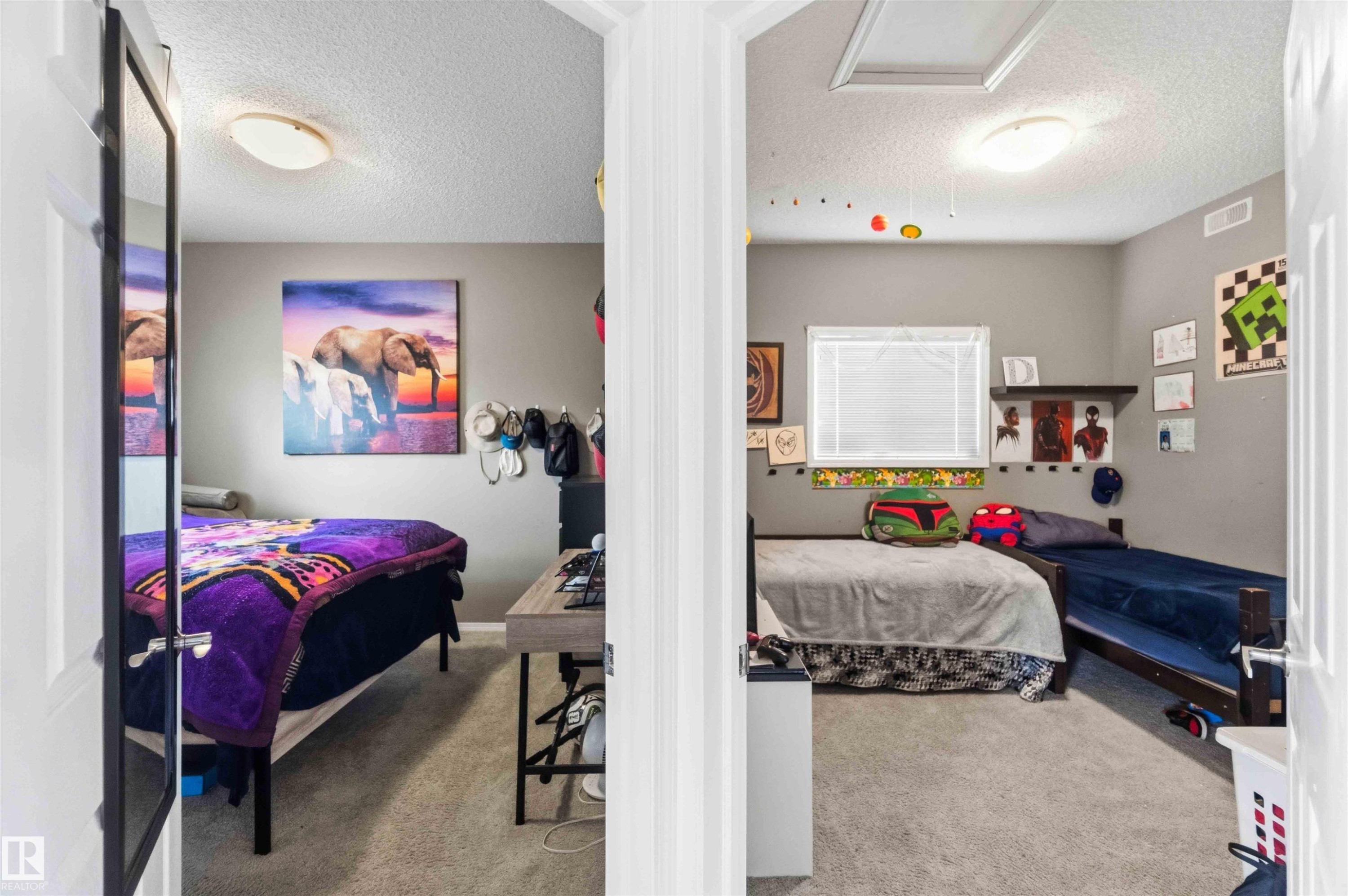Two distinct bedrooms featuring neutral wall tones, carpeted flooring, and flush-mount ceiling lighting - 24 6520 2 Avenue, Edmonton, AB