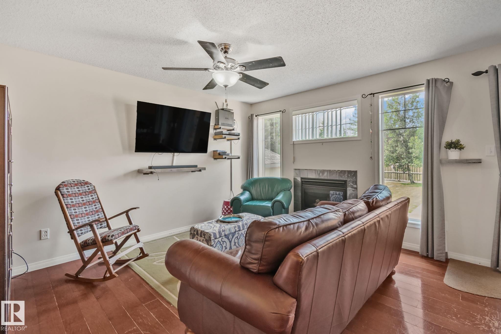 12248 16 Avenue Sw, Edmonton, AB - Indoor Photo Showing Living Room With Fireplace