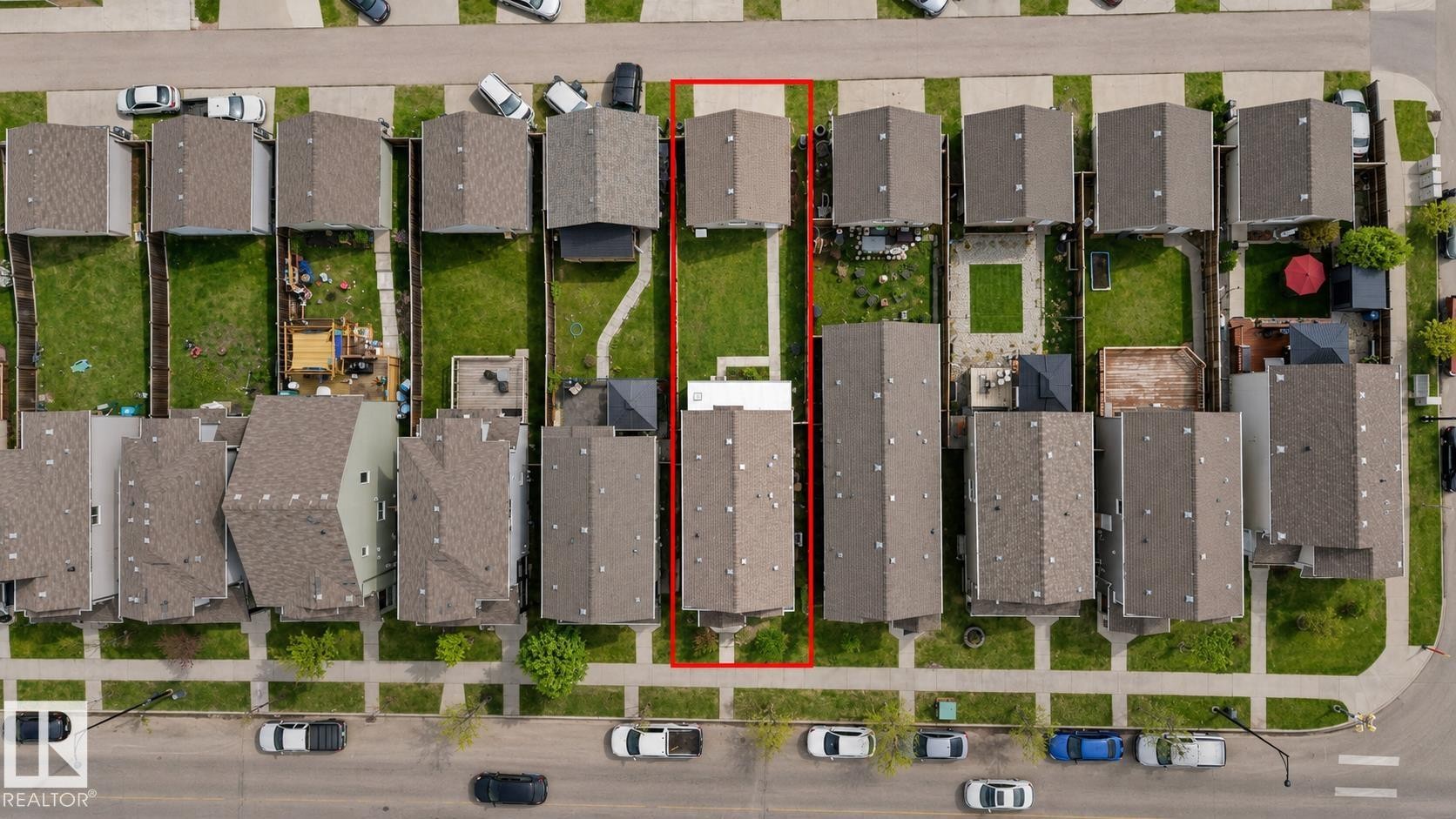 Aerial perspective showcasing a residential property with a detached rear garage and paved alley access - 445 Watt Boulevard Sw, Edmonton, AB -
