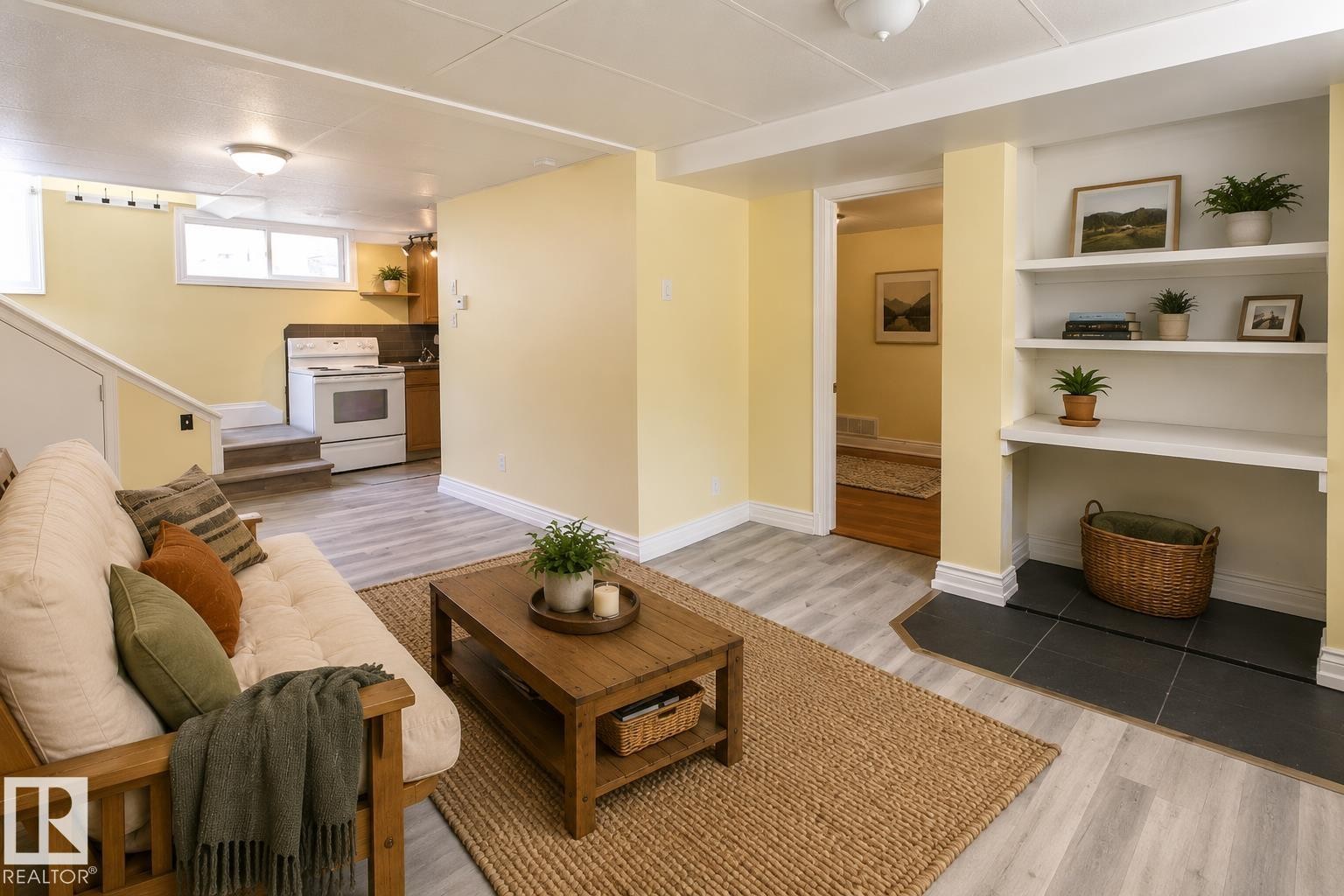 Finished living space with recessed lighting, light wood-finish flooring, built-in shelving, and a white oven/range - 11312 127 Street Nw, Edmonton, AB