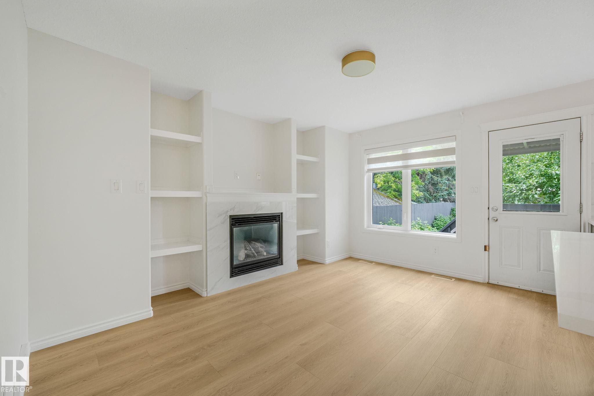 10216 150 Street Nw, Edmonton, AB - Indoor Photo Showing Other Room With Fireplace