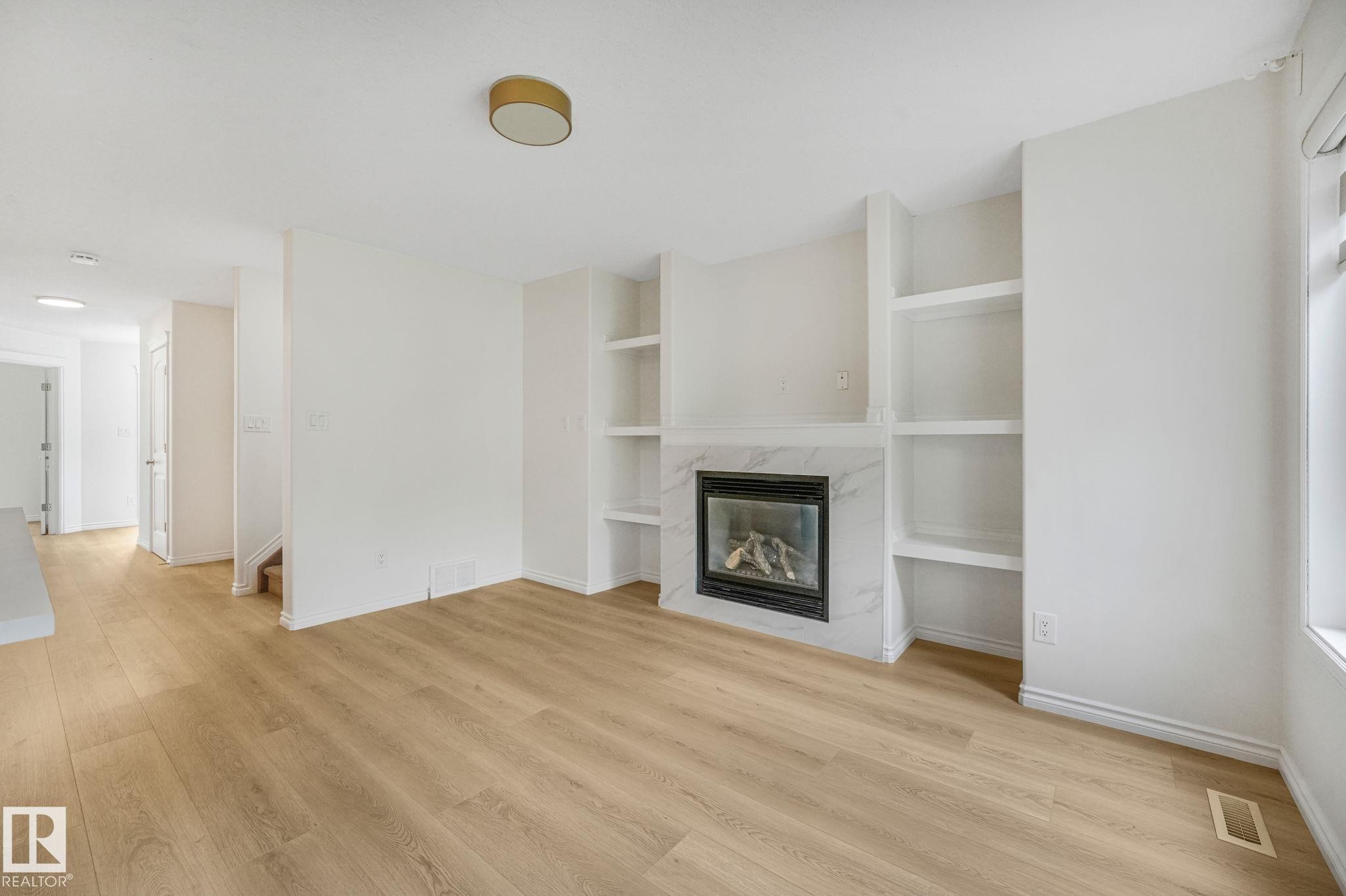 10216 150 Street Nw, Edmonton, AB - Indoor Photo Showing Other Room With Fireplace