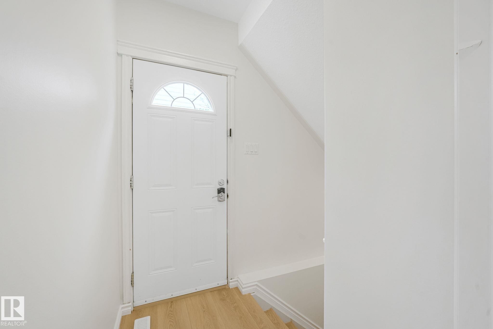 Secondary side entry door. - 10216 150 Street Nw, Edmonton, AB - Indoor Photo Showing Other Room