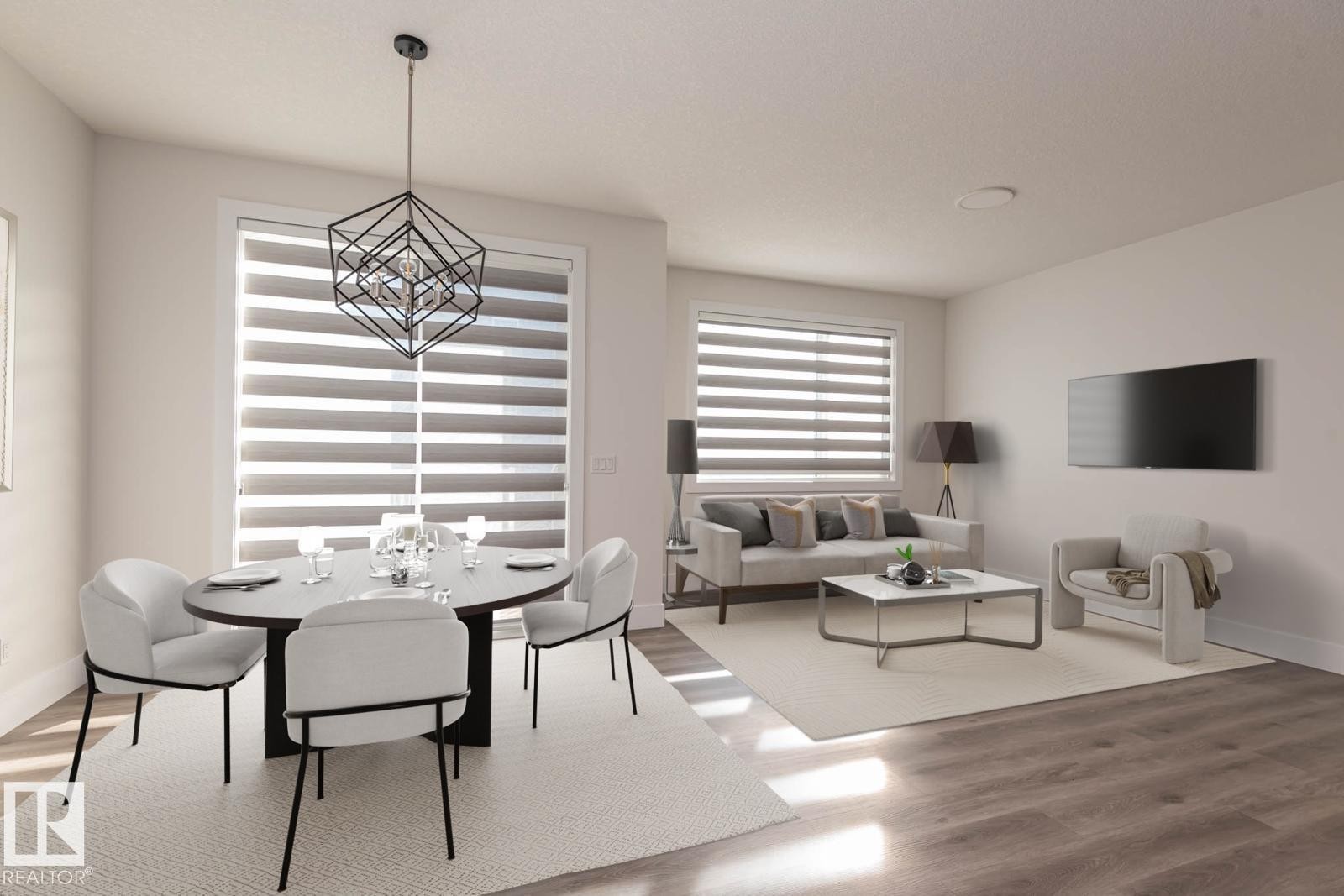 Combined dining and living area featuring wood-finish flooring - 2635 Donaghey Crescent, Edmonton, AB