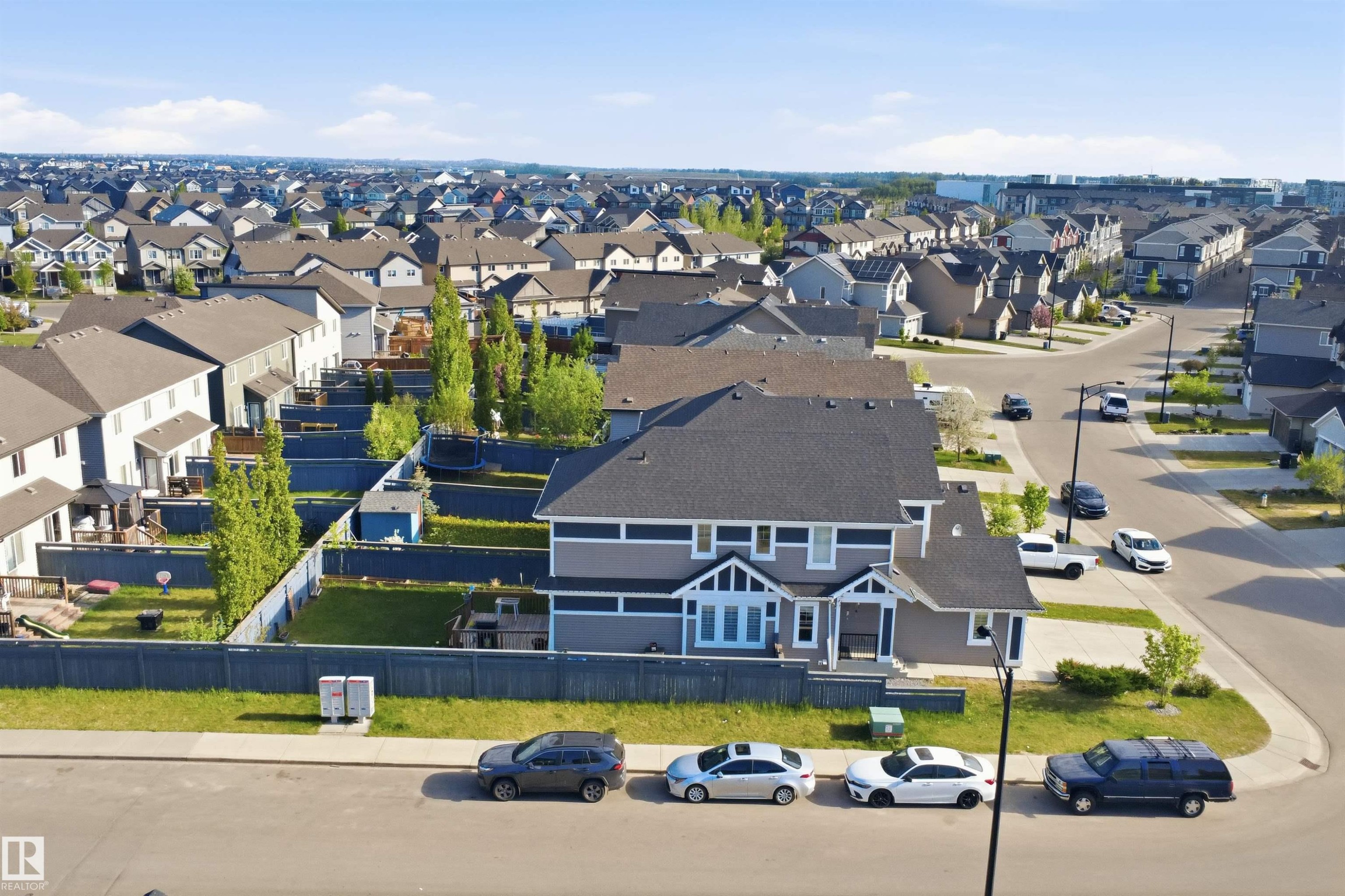 Two-story residence featuring a dark gray roof, light gray siding, and white trim accents - 1234 Daniels Crescent, Edmonton, AB - Outdoor With View