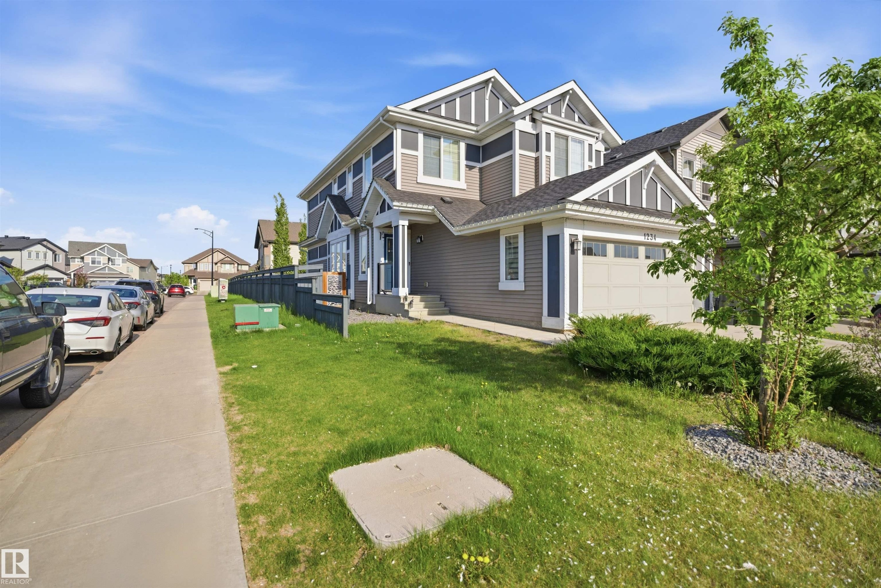 Contemporary two-story residence featuring a multi-toned exterior with horizontal siding and decorative gables - 1234 Daniels Crescent, Edmonton, AB - Outdoor