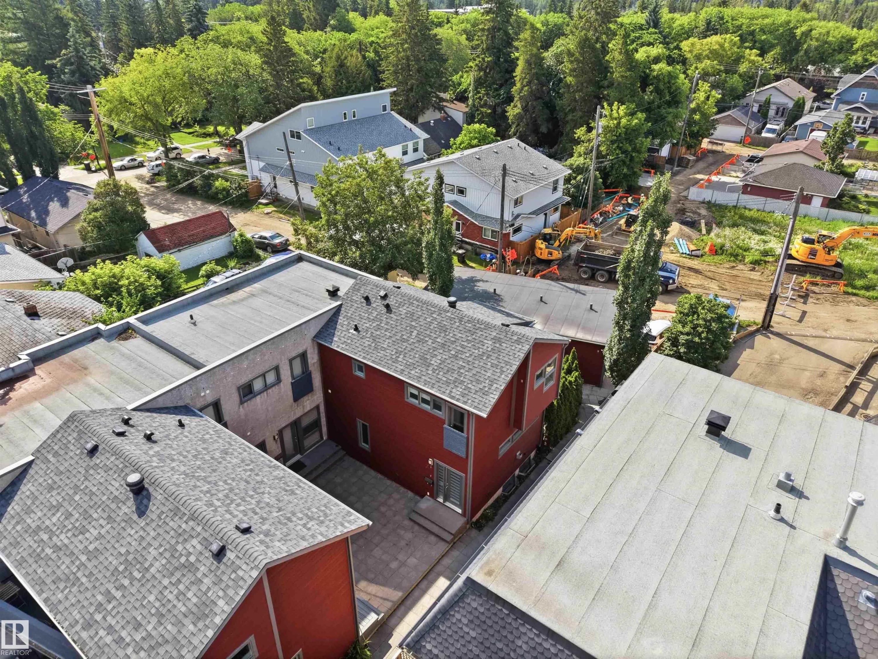 Multi-level property featuring red siding and a composition shingle roof - #1 14315 Stony Plain Nw, Edmonton, AB - Outdoor With Deck Patio Veranda