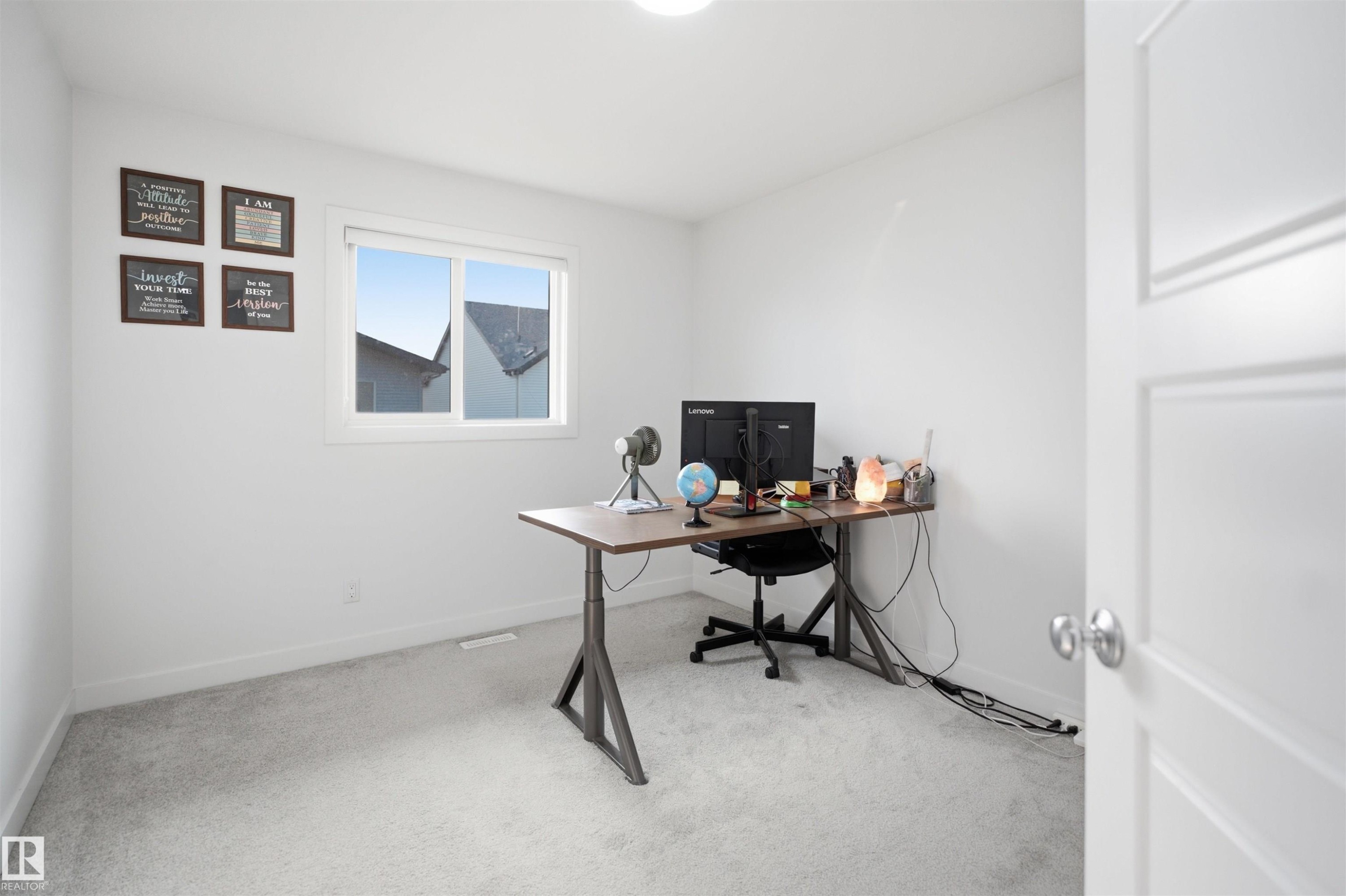 Light gray carpet flooring, white walls, and a large window with white trim - 2508 193 Street Nw, Edmonton, AB - Indoor Photo Showing Office