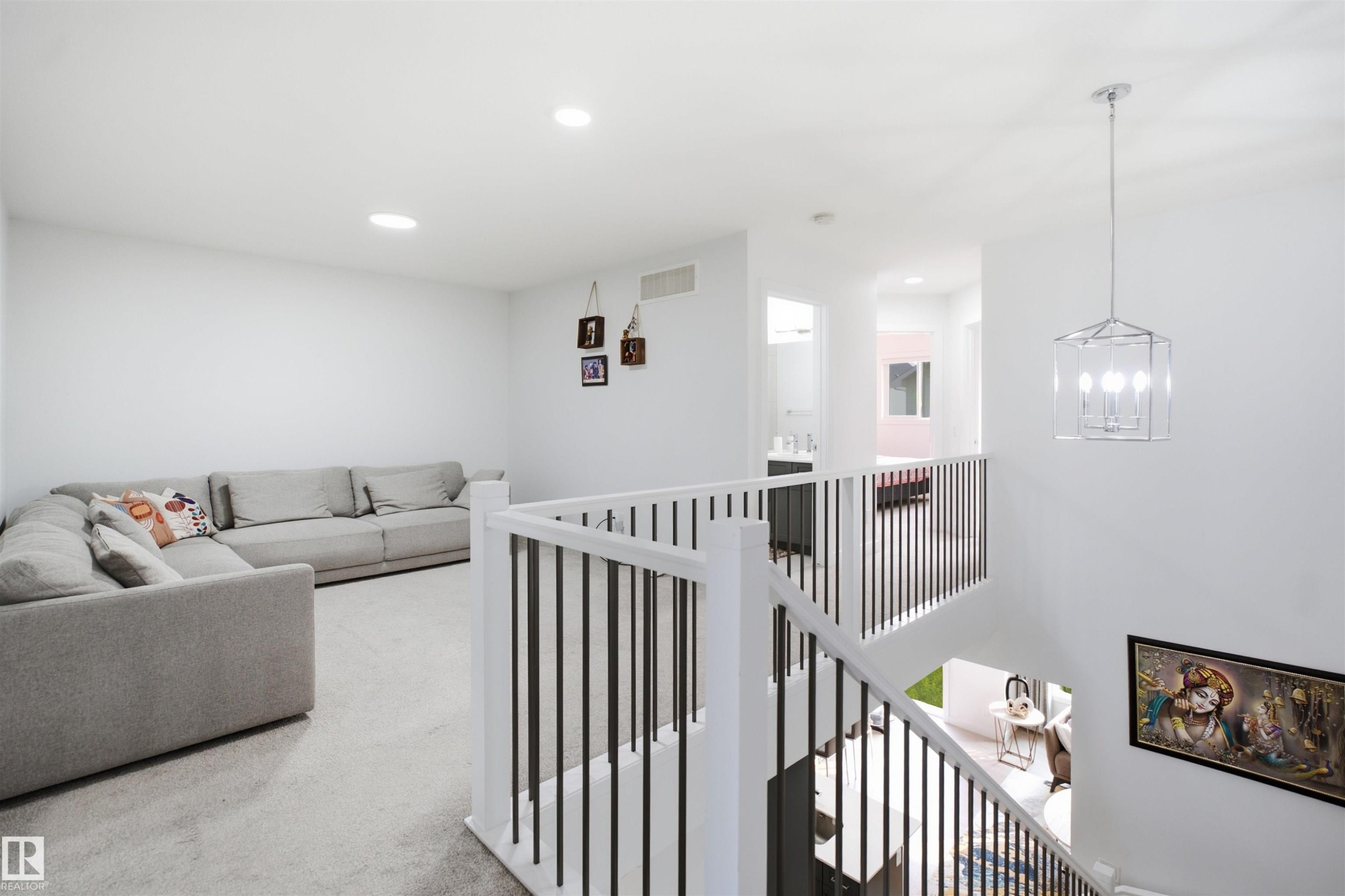 Open concept upper level featuring carpeted flooring and recessed lighting - 2508 193 Street Nw, Edmonton, AB - Indoor