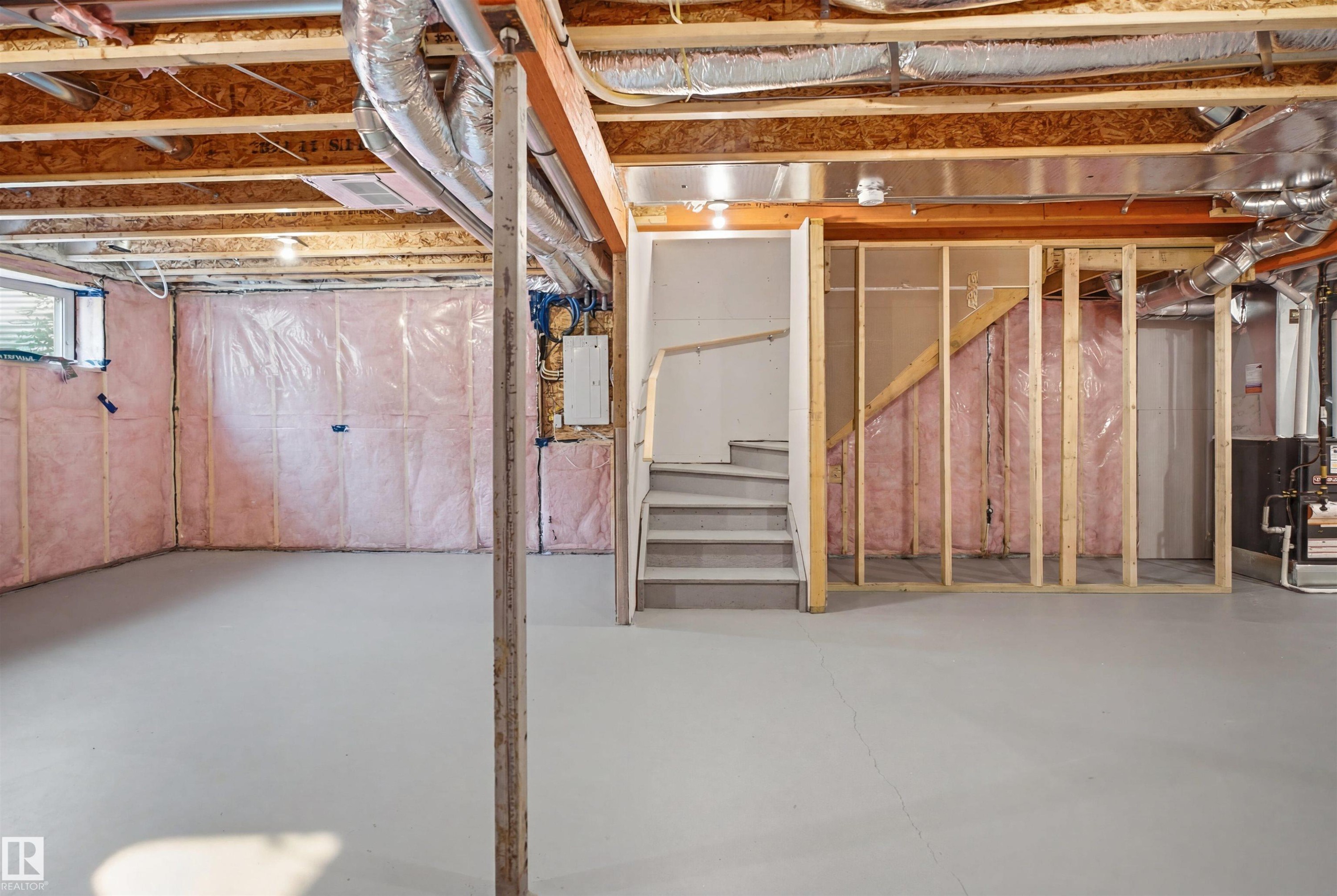 Unfinished basement featuring exposed wood joists, ductwork, and insulated walls - 2508 193 Street Nw, Edmonton, AB - Indoor Photo Showing Basement