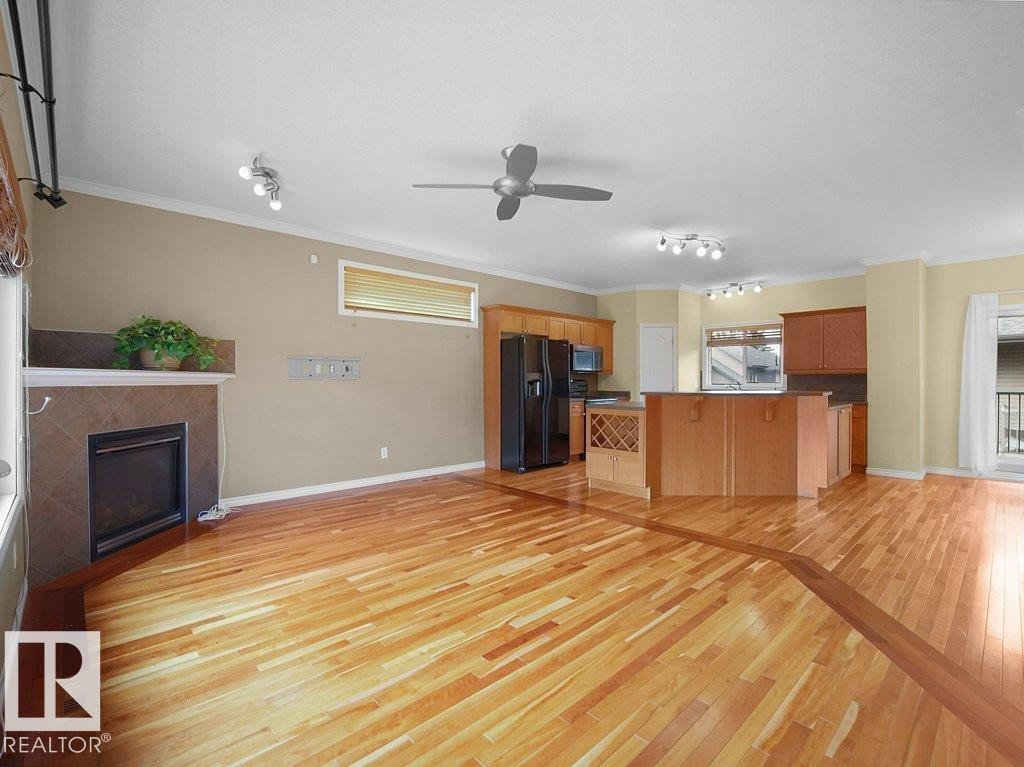 #30 17715 96 Av Nw, Edmonton, AB - Indoor Photo Showing Kitchen With Fireplace