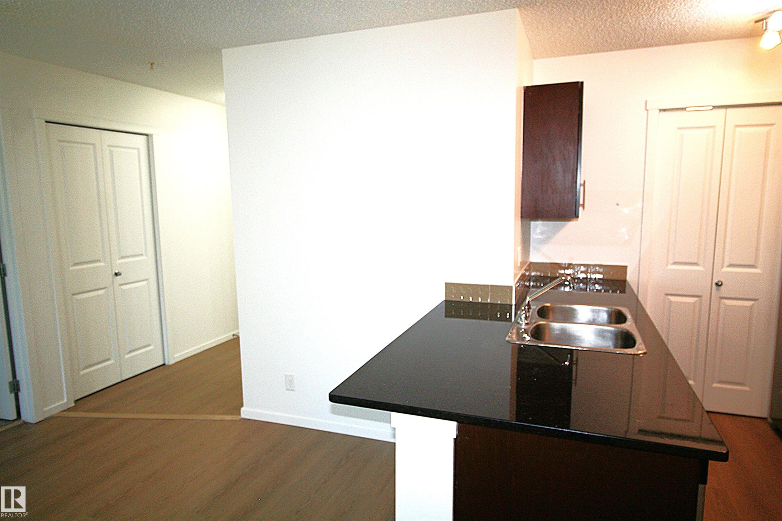 #316 5810 Mullen Pl Nw, Edmonton, AB - Indoor Photo Showing Kitchen With Double Sink