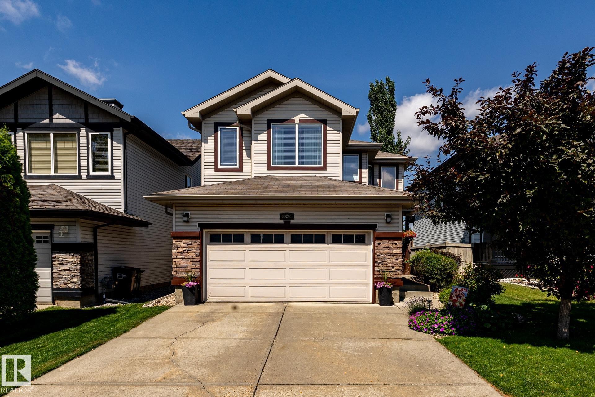 Contemporary two-story residence featuring light-toned siding and a brown trim - 5820 7 Avenue Sw, Edmonton, AB - Outdoor With Facade