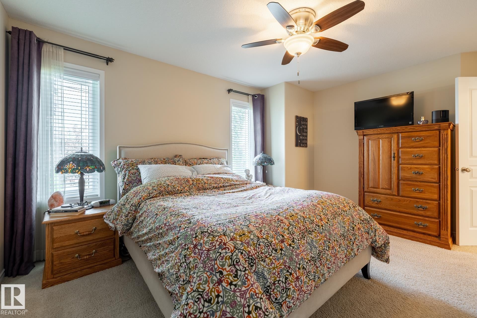Neutral-toned walls and carpeted flooring define this room - 5820 7 Avenue Sw, Edmonton, AB - Indoor Photo Showing Bedroom