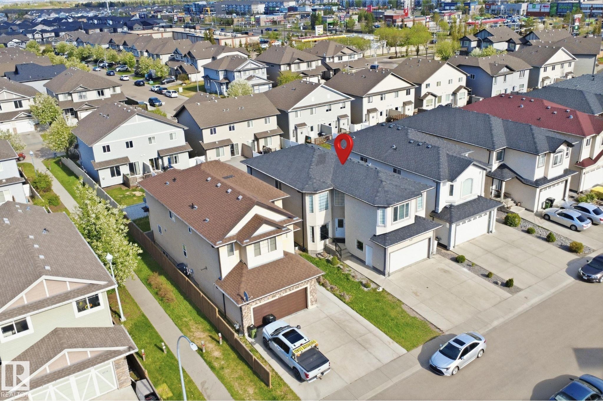 Contemporary two-story residence with an attached double-car garage - 16807 54 Street, Edmonton, AB - Outdoor With View