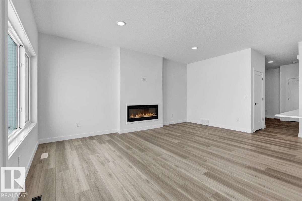 139 Caledon Crescent, Spruce Grove, AB - Indoor Photo Showing Living Room With Fireplace
