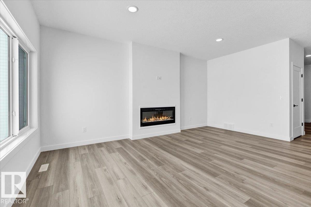 139 Caledon Crescent, Spruce Grove, AB - Indoor Photo Showing Living Room With Fireplace