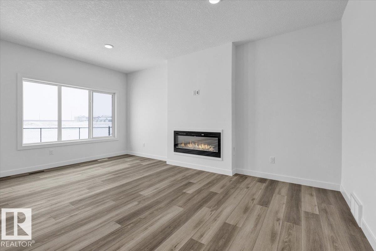 139 Caledon Crescent, Spruce Grove, AB - Indoor Photo Showing Living Room With Fireplace
