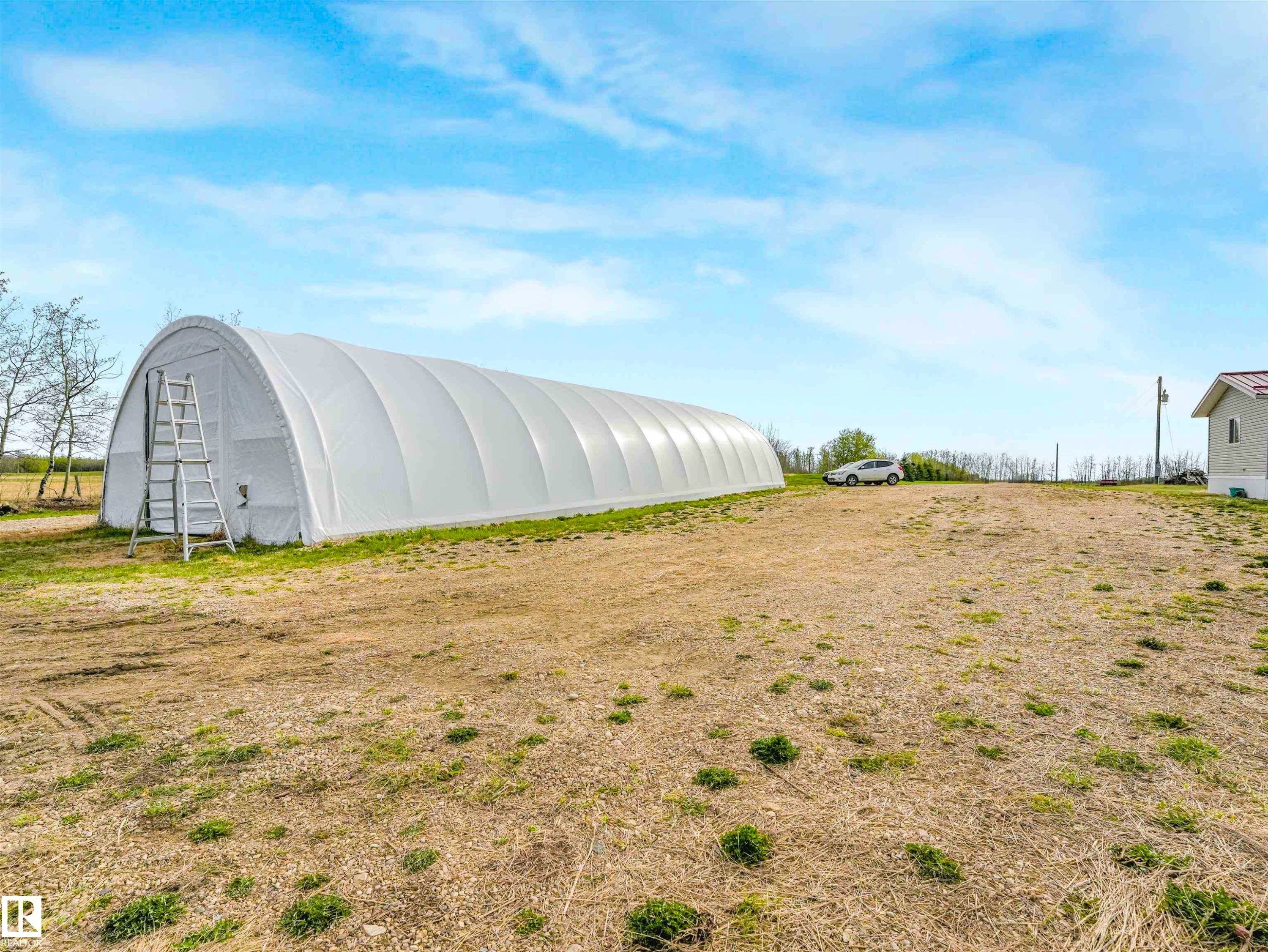 Long hoop house structure on a spacious lot - 57016 Range Road 13, Rural Barrhead County, AB - Outdoor