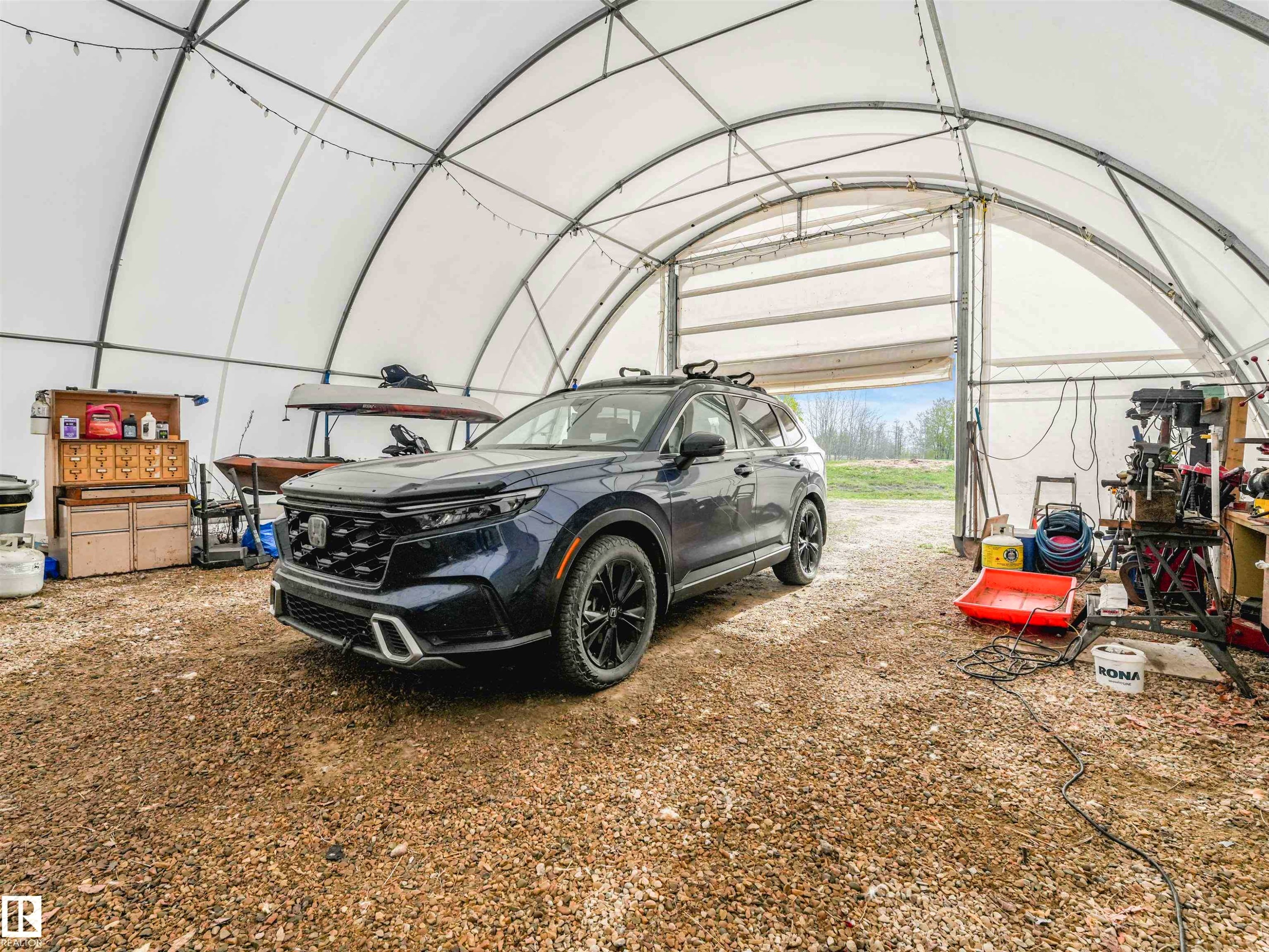 Image quality insufficient for description - 57016 Range Road 13, Rural Barrhead County, AB - Indoor Photo Showing Garage