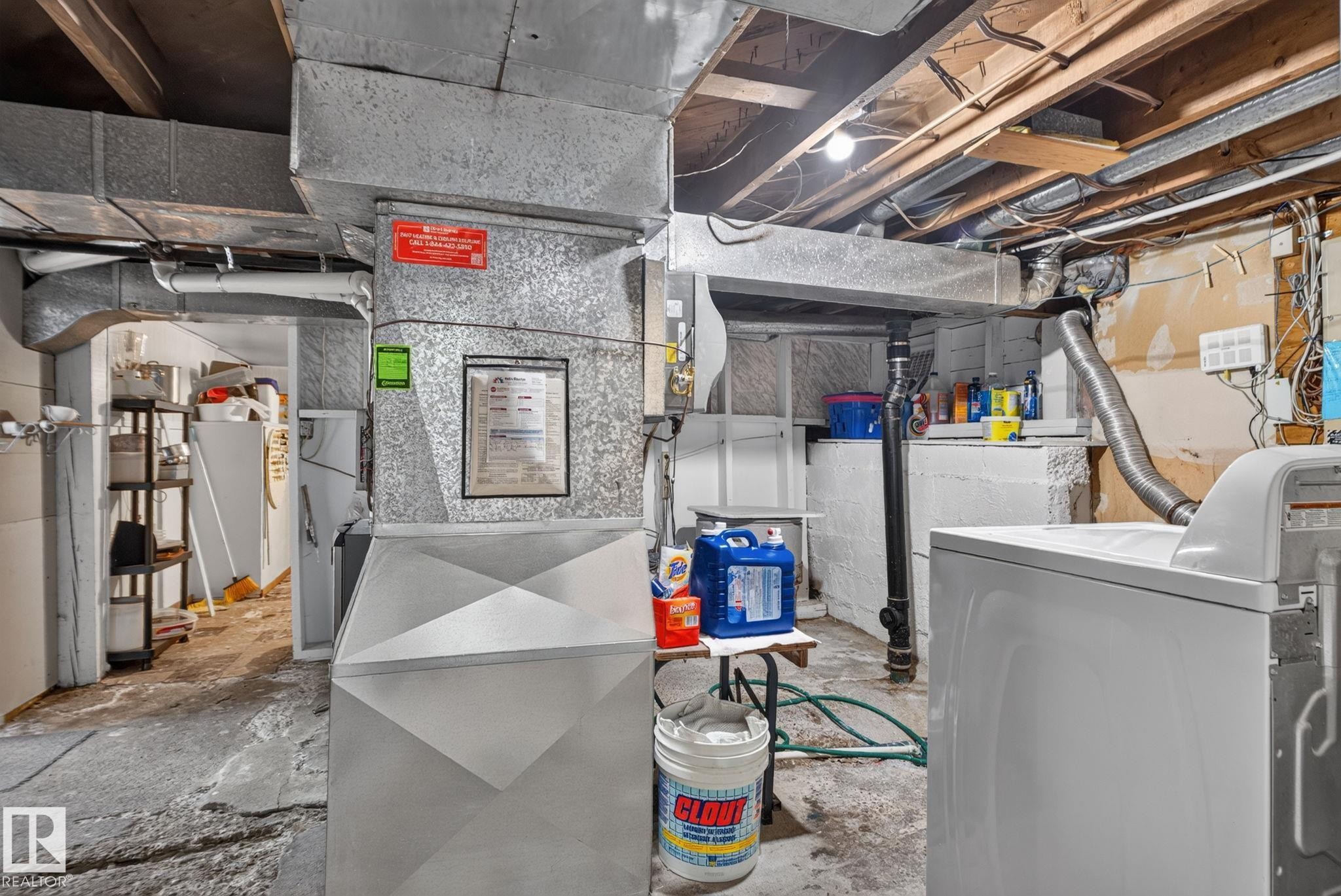 Galvanized steel ductwork system with exposed wooden ceiling joists and concrete flooring - 12703 122 Street Nw, Edmonton, AB