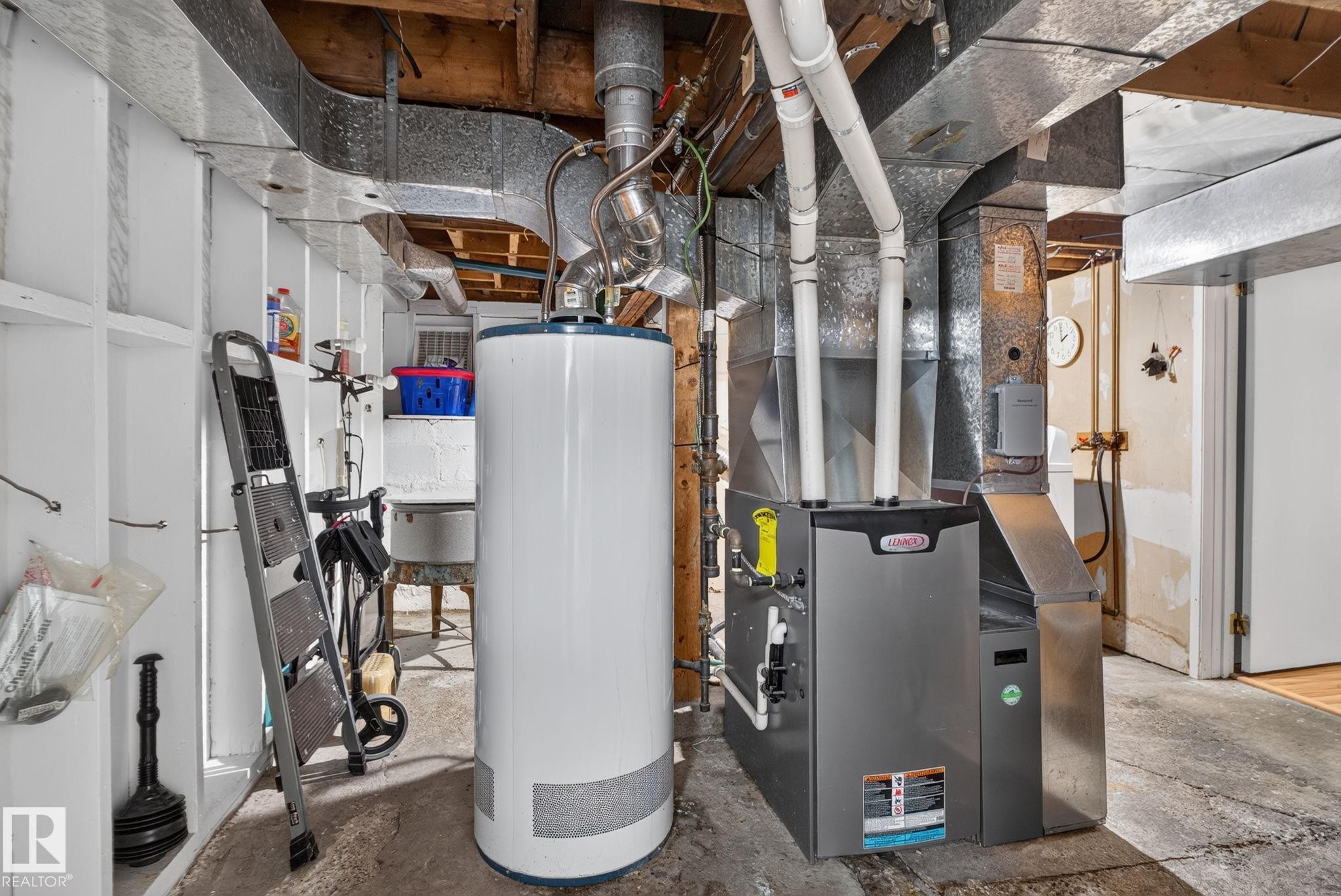 Utility area featuring a Lennox furnace and a water heater - 12703 122 Street Nw, Edmonton, AB