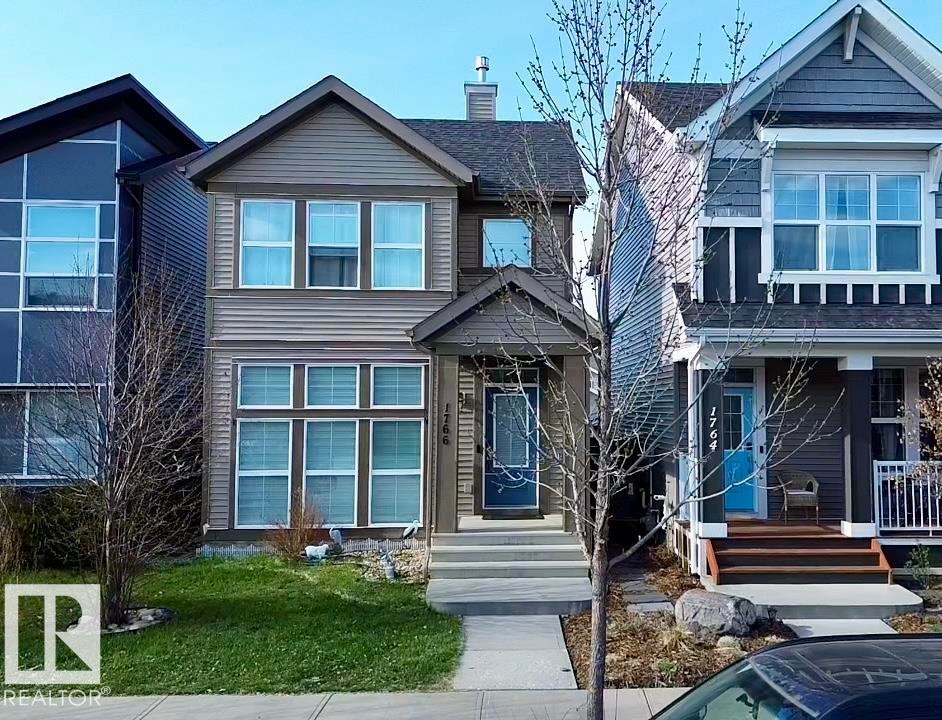 Two-story residence featuring horizontal siding and a prominent front gable - 1766 Dumont Crescent Sw, Edmonton, AB - Outdoor With Facade