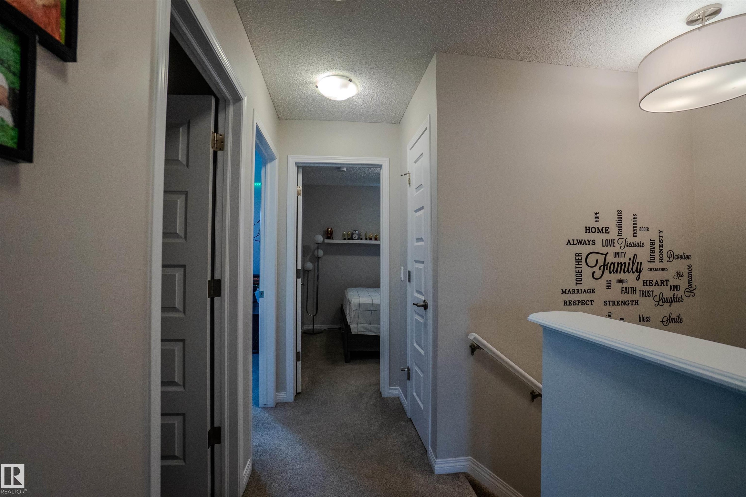 Hallway featuring neutral wall colors, carpeted flooring, and white trim - 1766 Dumont Crescent Sw, Edmonton, AB - Indoor Photo Showing Other Room