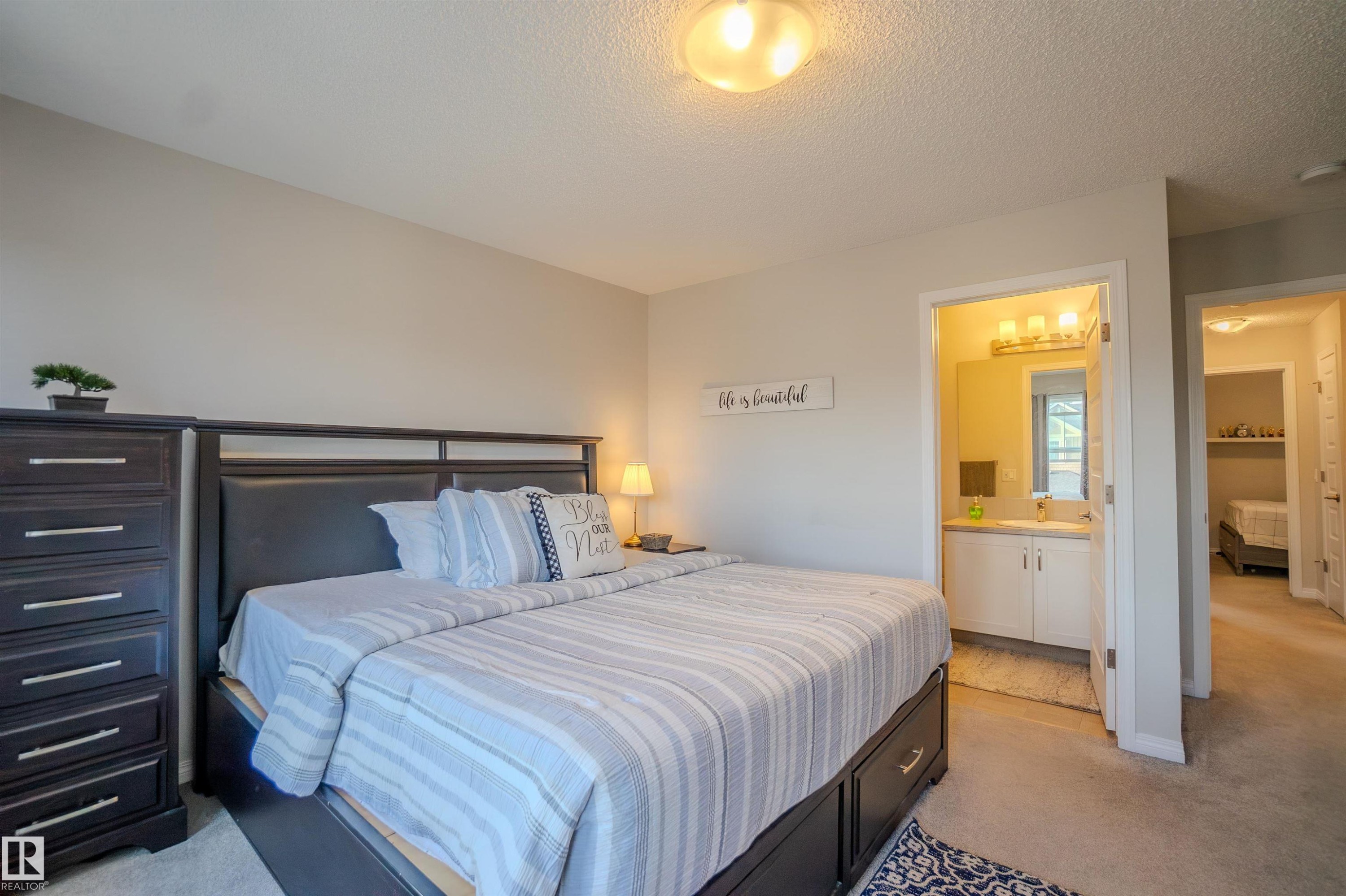 Bedroom featuring neutral wall paint and carpet flooring - 1766 Dumont Crescent Sw, Edmonton, AB - Indoor Photo Showing Bedroom