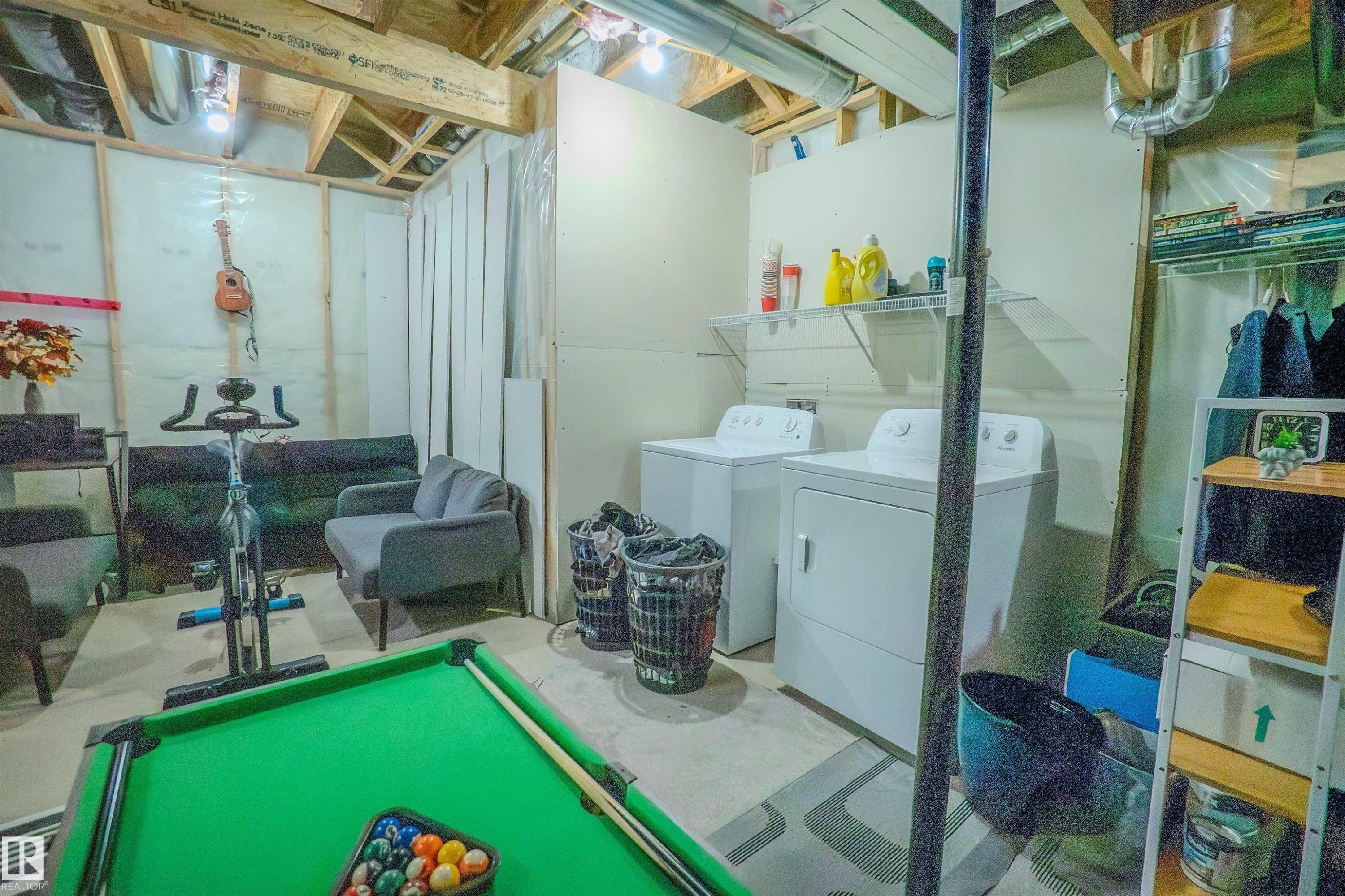 Unfinished basement offering flexible potential with exposed ceiling joists and visible ductwork - 1766 Dumont Crescent Sw, Edmonton, AB - Indoor Photo Showing Laundry Room