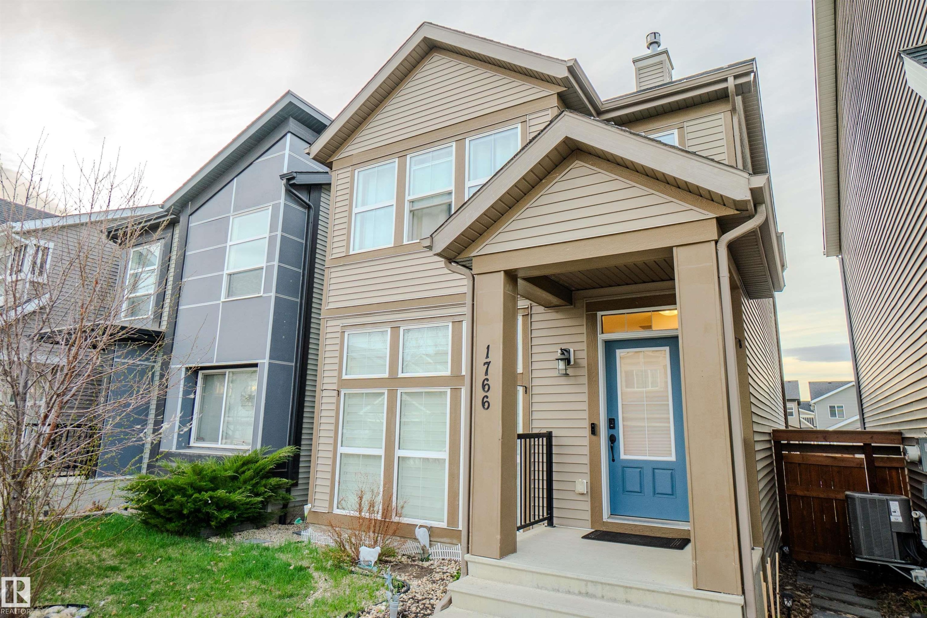 Two-story home with light beige horizontal siding and contrasting trim - 1766 Dumont Crescent Sw, Edmonton, AB - Outdoor
