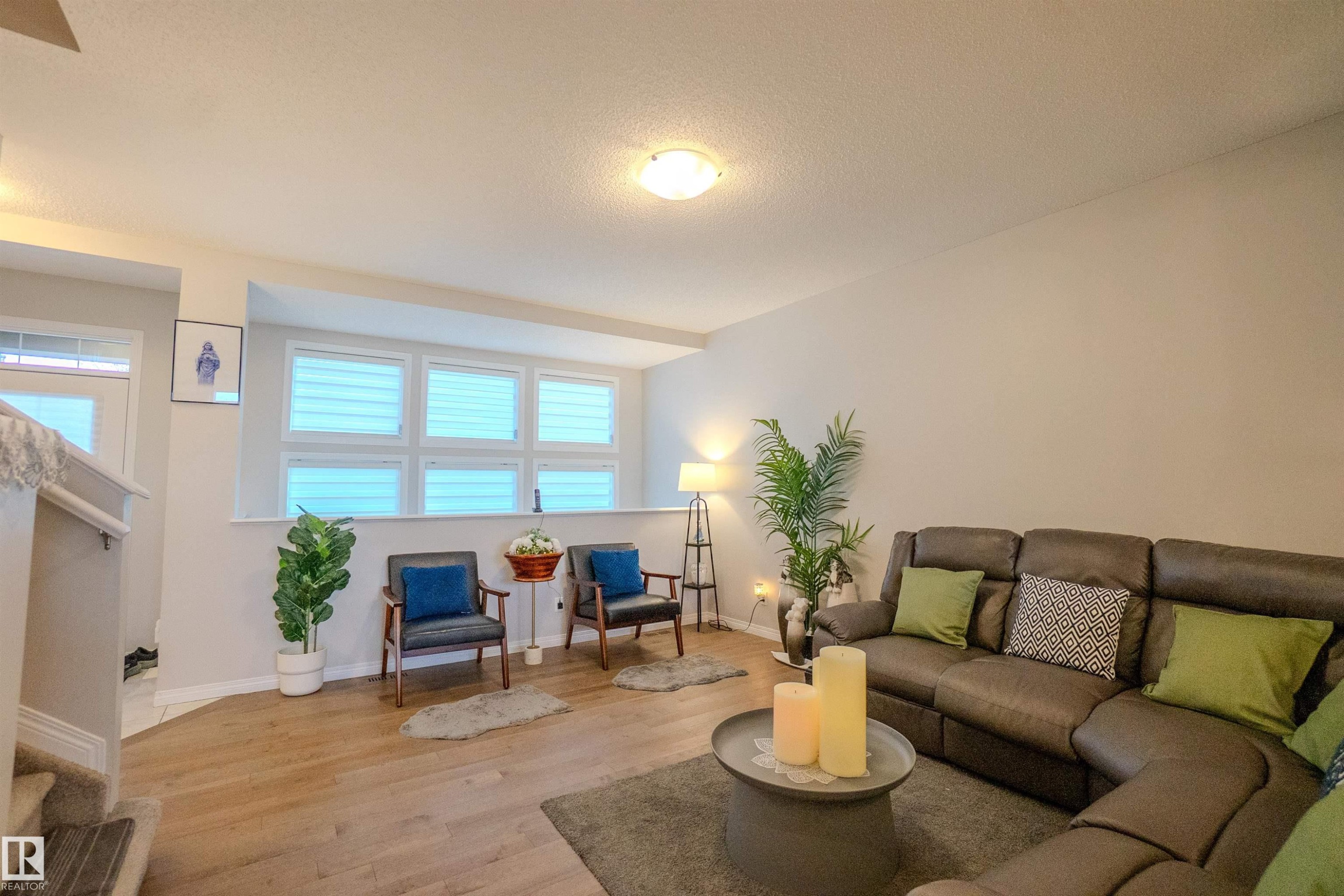 Wood-finish flooring, recessed lighting, and a white interior paint scheme - 1766 Dumont Crescent Sw, Edmonton, AB - Indoor Photo Showing Living Room
