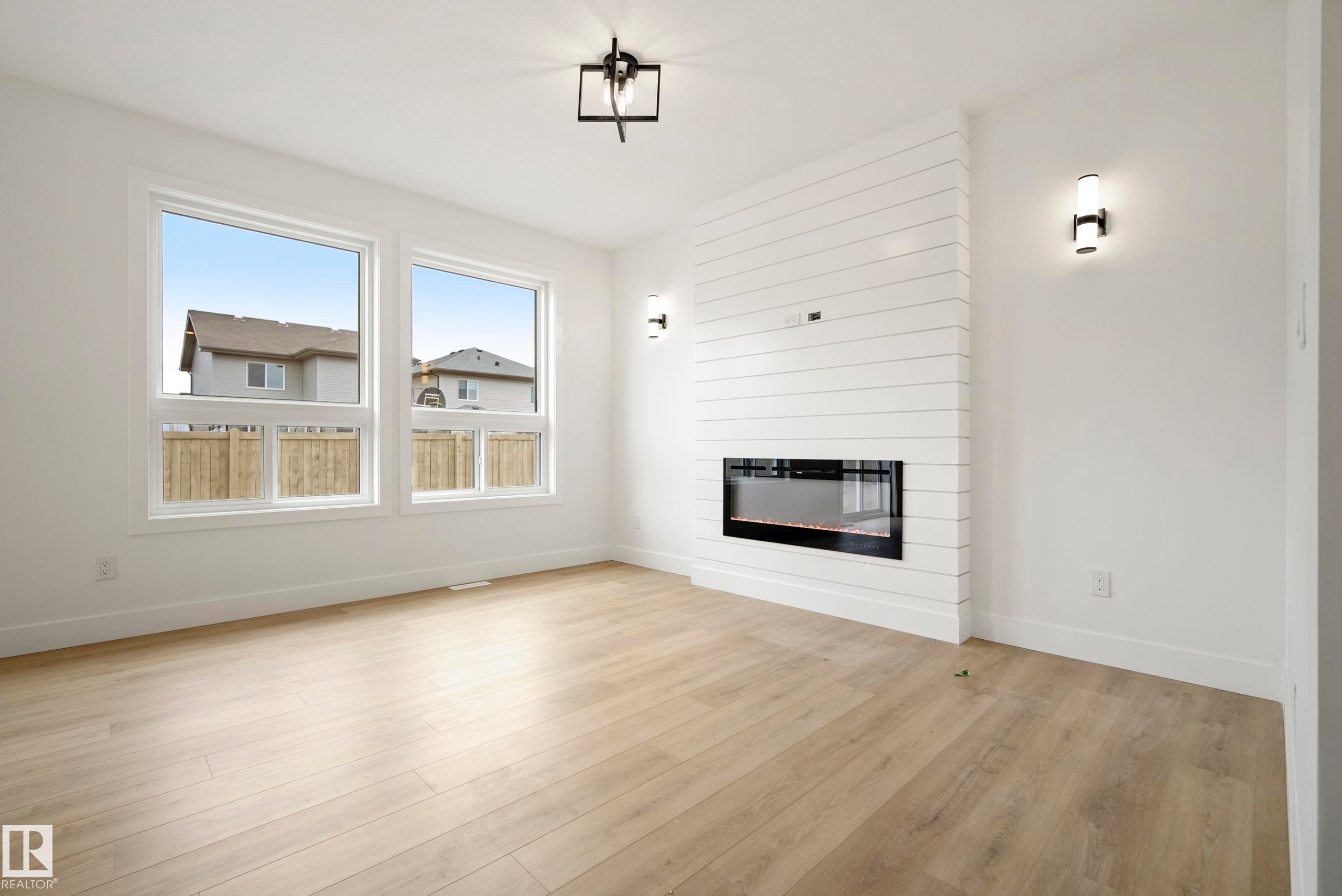 113 Caledon Crescent, Spruce Grove, AB - Indoor Photo Showing Living Room With Fireplace