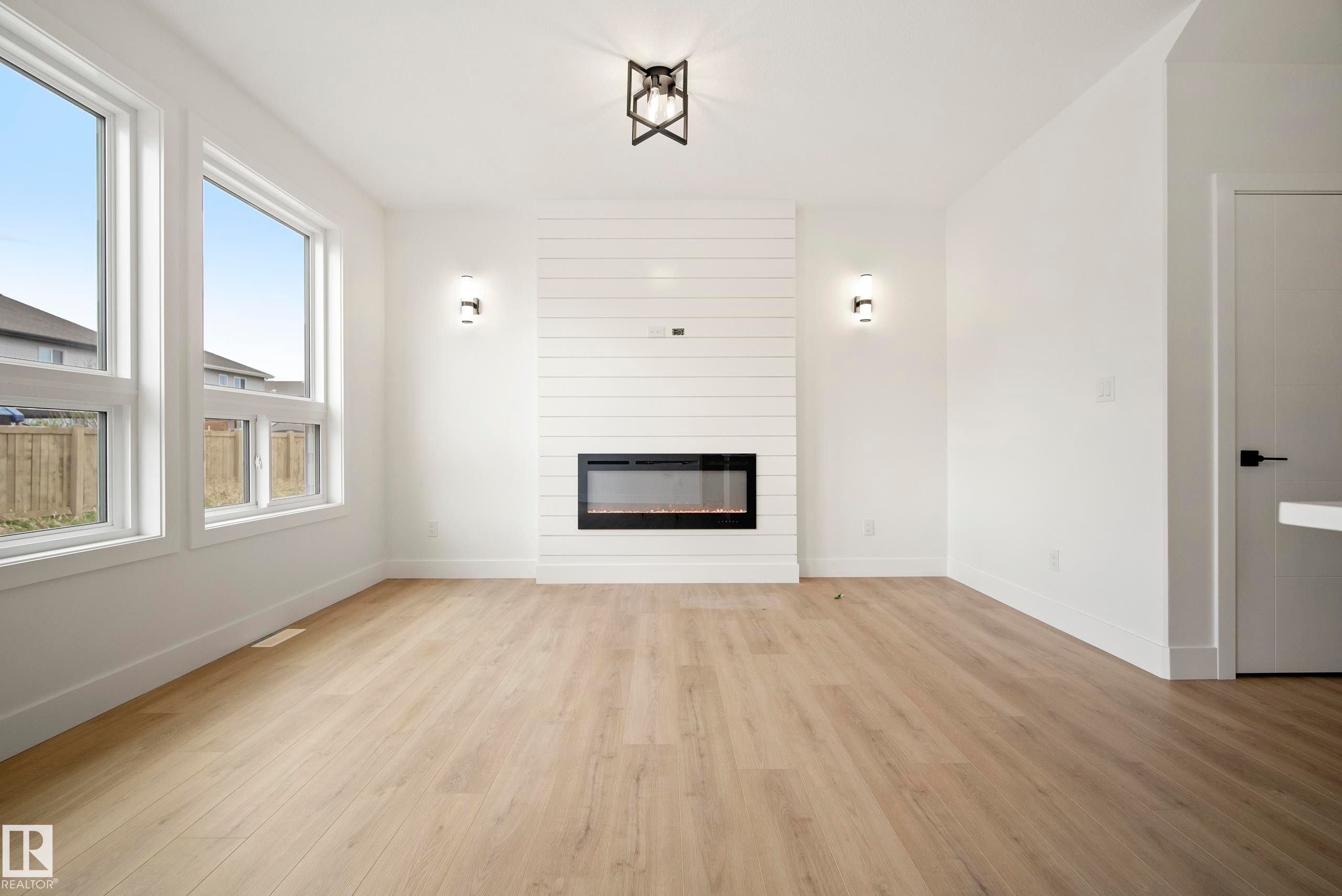113 Caledon Crescent, Spruce Grove, AB - Indoor Photo Showing Living Room With Fireplace