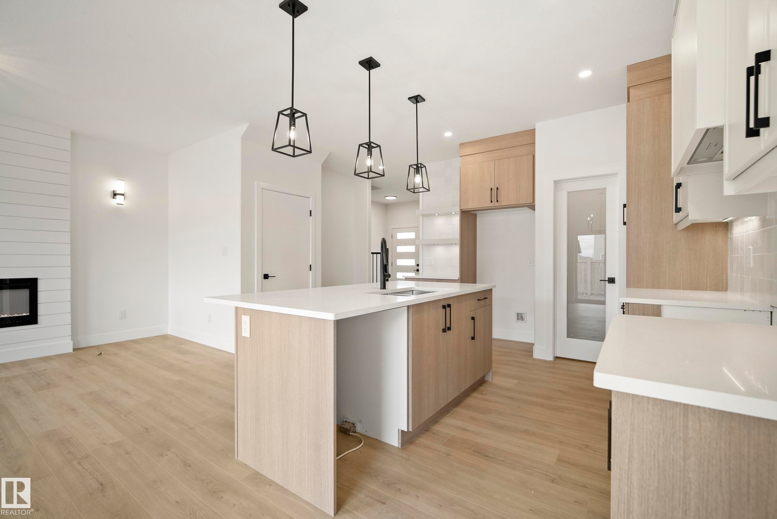 113 Caledon Crescent, Spruce Grove, AB - Indoor Photo Showing Kitchen With Fireplace
