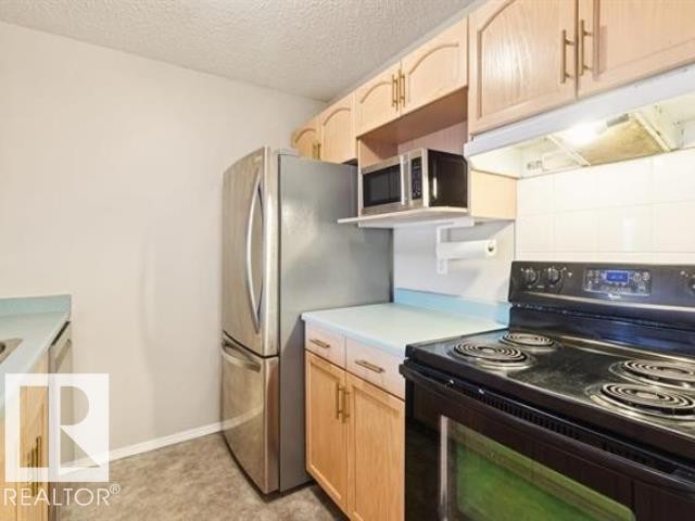 #267 10520 120 St Nw, Edmonton, AB - Indoor Photo Showing Kitchen