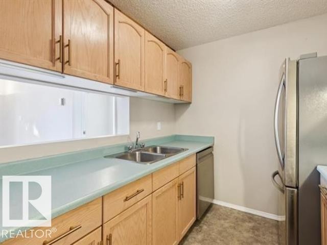 #267 10520 120 St Nw, Edmonton, AB - Indoor Photo Showing Kitchen With Double Sink