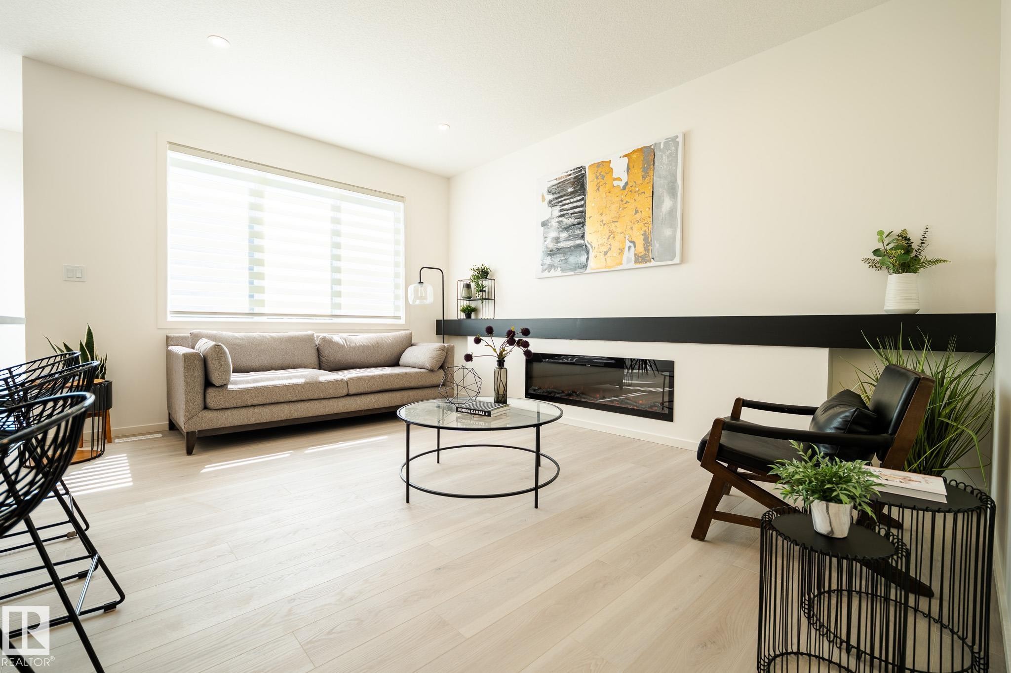 7705 174A Avenue, Edmonton, AB - Indoor Photo Showing Living Room With Fireplace